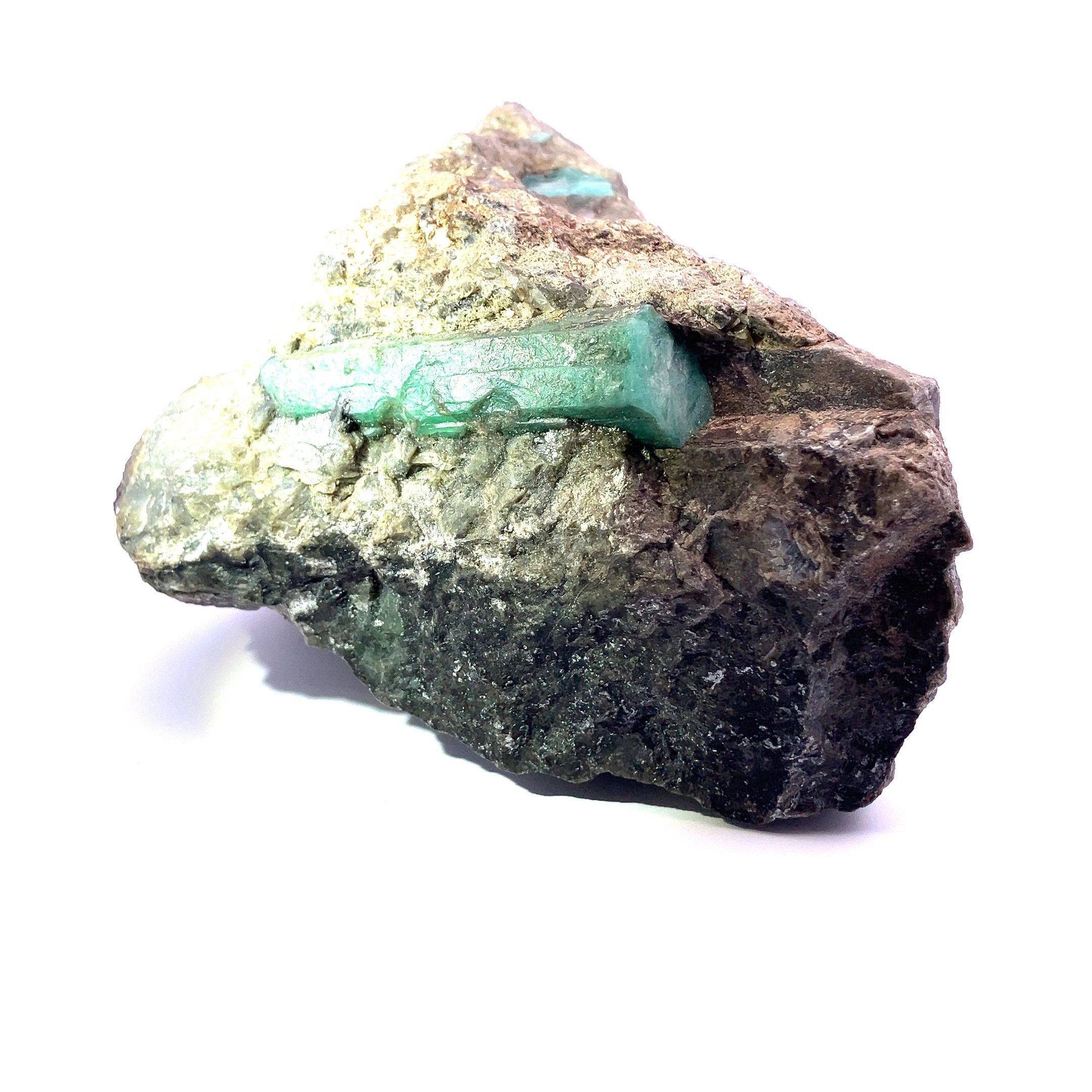 Discover the captivating allure of nature's artistry with our exclusive Emerald Crystals in Mica Schist Matrix, a stunning addition to the Rare Earth Gallery collection. This exquisite specimen combines the opulence of emerald crystals with the intricate beauty of mica schist, creating a mesmerizing natural masterpiece that will enchant collectors and enthusiasts alike. Nestled within the sparkling layers of mica schist, these vibrant green emerald crystals exude a rich, verdant elegance that captures the essence of luxury and refinement.The juxtaposition of deep emerald hues against the shimmering tones of mica creates a stunning contrast, highlighting the intricate patterns and textures formed over millions of years. Emerald Crystals In Mica Schist Matrix