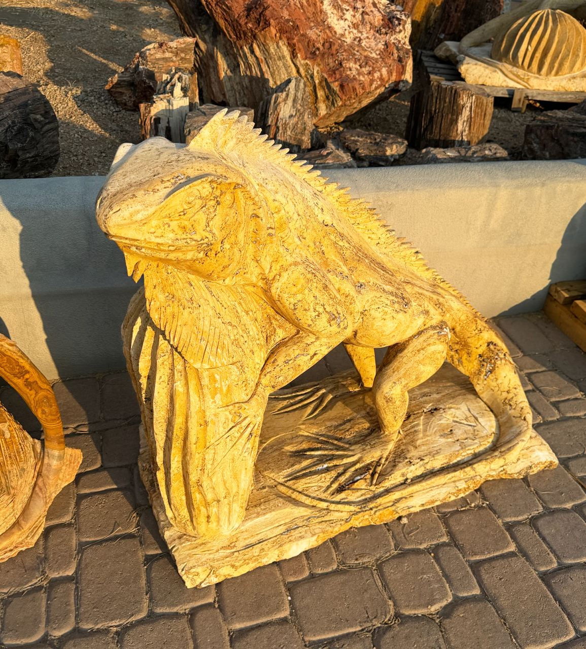 Tan Travertine Sculpture of Iguana with Chin Resting on Barrel Cactus Travertine Iguana With Cactus Carving