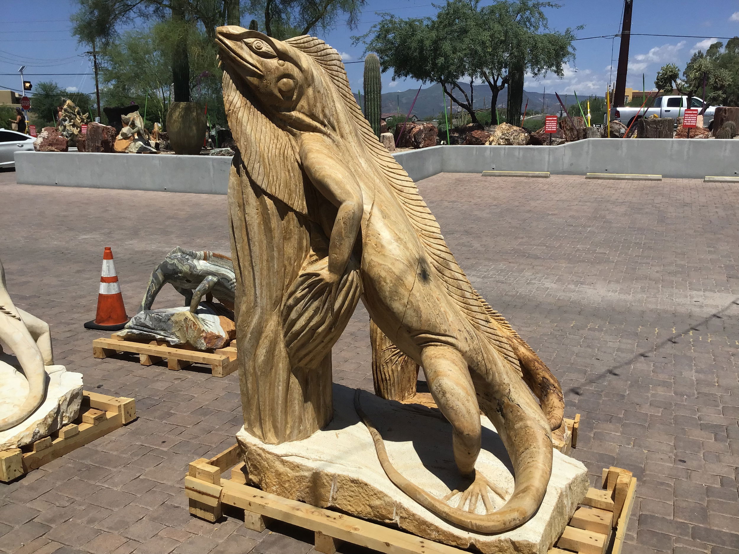 Tan Travertine Sculpture of Iguana Standing with Neck & Front Legs Resting on Tall Barrel Cactus Travertine Iguana On Cactus Carving - Large