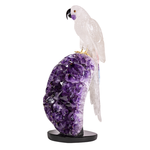 Closeup photo of Quartz Macaw With Aquamarine Tail Feather Atop Polished Amethyst Geode