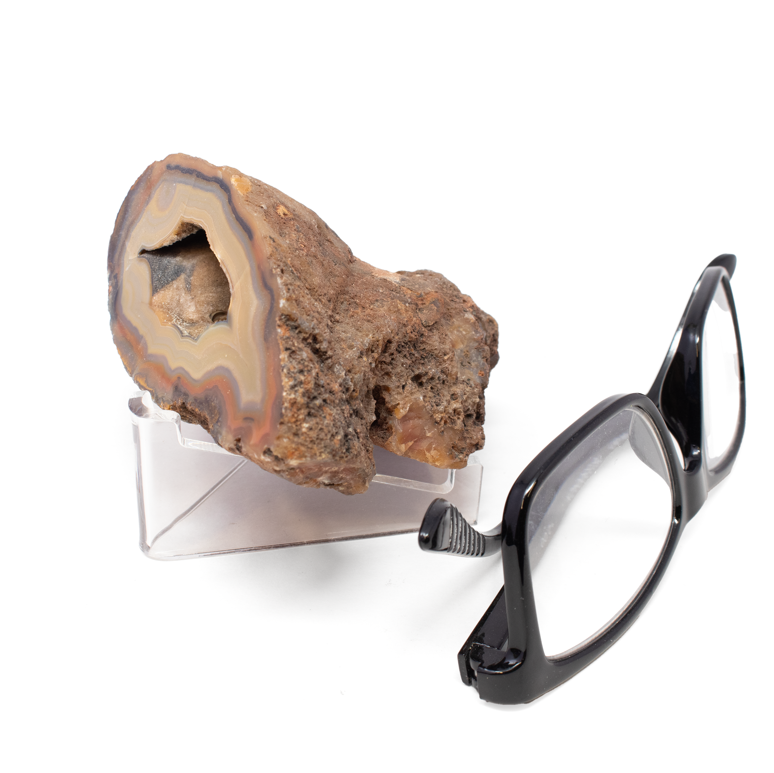 Discover the mesmerizing beauty of the Laguna Agate Geode, a true masterpiece of nature's artistry. Renowned for its striking patterns and vibrant colors, this exquisite geode is a must-have addition for any mineral enthusiast or collector.The Laguna Agate Geode boasts a captivating brown face that exudes warmth and earthiness. Its unique striations and banding reveal intricate layers of history, providing a glimpse into the geological forces that shaped its spectacular form over millions of years.At its core, this geode unfolds into a stunning deep druze pocket, where a myriad of sparkling crystals eagerly catch the light. Laguna Agate Geode - Brown Face With Deep Druze Pocket