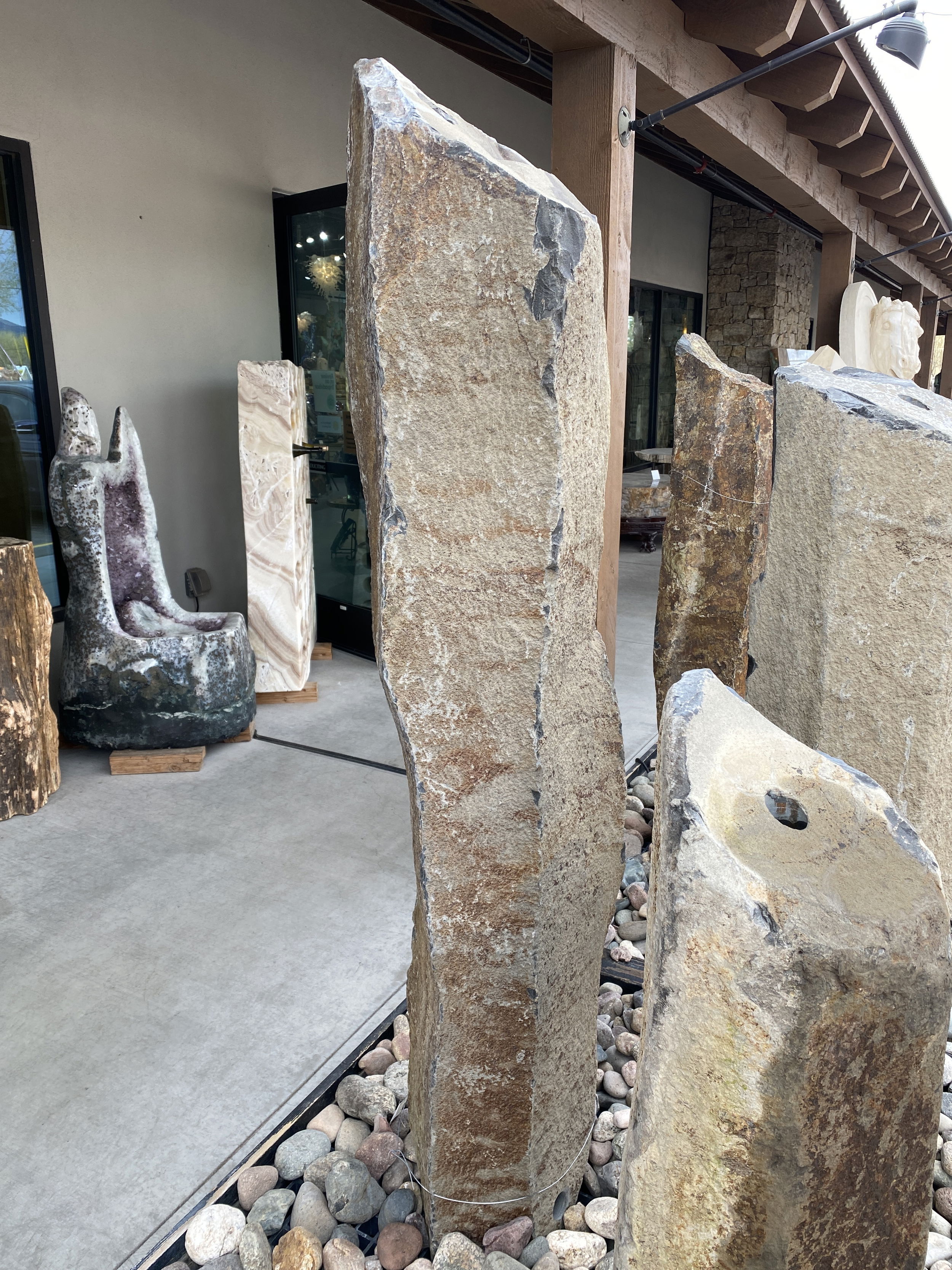 The Red Bluff Basalt Column 5' Fountain is a visually stunning addition for your yard, garden, or patio that brings tranquility and enhances the aesthetics of any space. Crafted from premium basalt, this fountain exudes a sense of natural beauty, creating a serene ambiance for relaxation and enjoyment. Let Rare Earth Gallery’s white-glove service make your fountain dreams come true—simply choose your fountain, tell us where it goes, and we’ll handle the rest, from delivery to installation. IMPORTANT: the purchase price listed is for the FOUNTAIN ONLY and DOES NOT INCLUDE the cost of a basin, pump, parts or installation. Before purchasing a fountain online, we STRONGLY recommend you call us at (480) 575-4360 for a FREE consultation to discuss these additional costs and schedule a pre-site inspection. Also, free shipping does NOT apply to fountains, please call for a quote. Red Bluff Basalt Column 5' Fountain