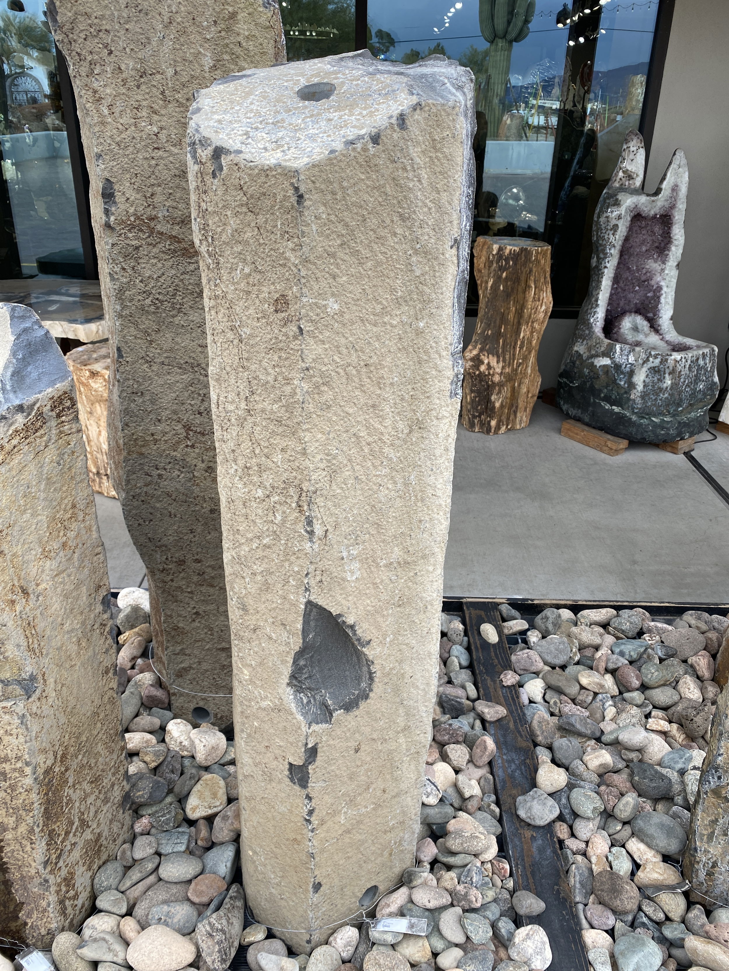 The Red Bluff Basalt Column 4' Fountain is a visually stunning addition for your yard, garden, or patio that brings tranquility and enhances the aesthetics of any space. Crafted from premium basalt, this fountain exudes a sense of natural beauty, creating a serene ambiance for relaxation and enjoyment. Let Rare Earth Gallery’s white-glove service make your fountain dreams come true—simply choose your fountain, tell us where it goes, and we’ll handle the rest, from delivery to installation. IMPORTANT: the purchase price listed is for the FOUNTAIN ONLY and DOES NOT INCLUDE the cost of a basin, pump, parts or installation. Before purchasing a fountain online, we STRONGLY recommend you call us at (480) 575-4360 for a FREE consultation to discuss these additional costs and schedule a pre-site inspection. Also, free shipping does NOT apply to fountains, please call for a quote. Red Bluff Basalt Column 4' Fountain