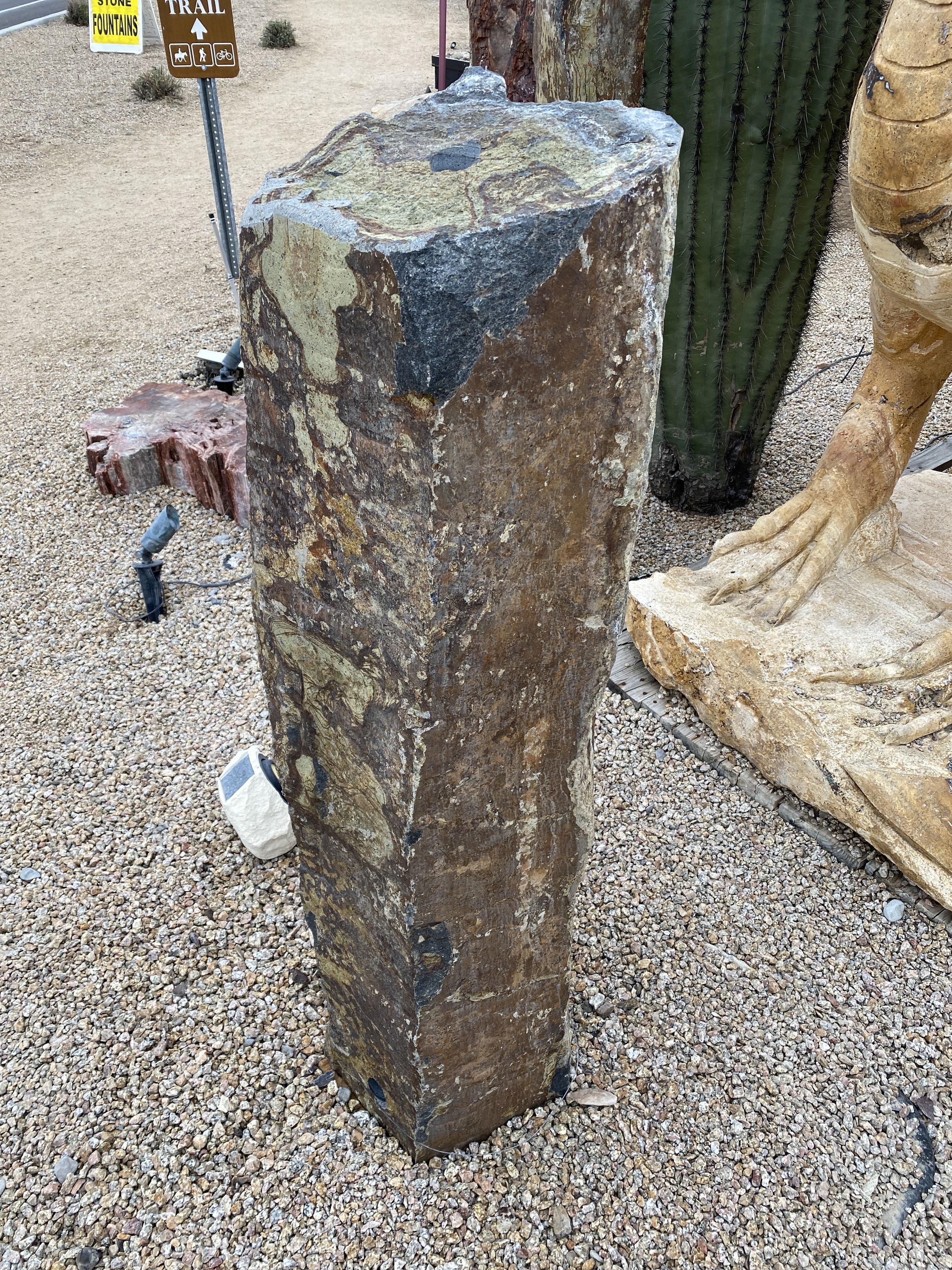 The Gold Creek Basalt Column 4' Fountain is a visually stunning addition for your yard, garden, or patio that brings tranquility and enhances the aesthetics of any space. Crafted from premium basalt, this fountain exudes a sense of natural beauty, creating a serene ambiance for relaxation and enjoyment. Let Rare Earth Gallery’s white-glove service make your fountain dreams come true—simply choose your fountain, tell us where it goes, and we’ll handle the rest, from delivery to installation. IMPORTANT: the purchase price listed is for the FOUNTAIN ONLY and DOES NOT INCLUDE the cost of a basin, pump, parts or installation. Before purchasing a fountain online, we STRONGLY recommend you call us at (480) 575-4360 for a FREE consultation to discuss these additional costs and schedule a pre-site inspection. Also, free shipping does NOT apply to fountains, please call for a quote. Gold Creek Basalt Column 4' Fountain