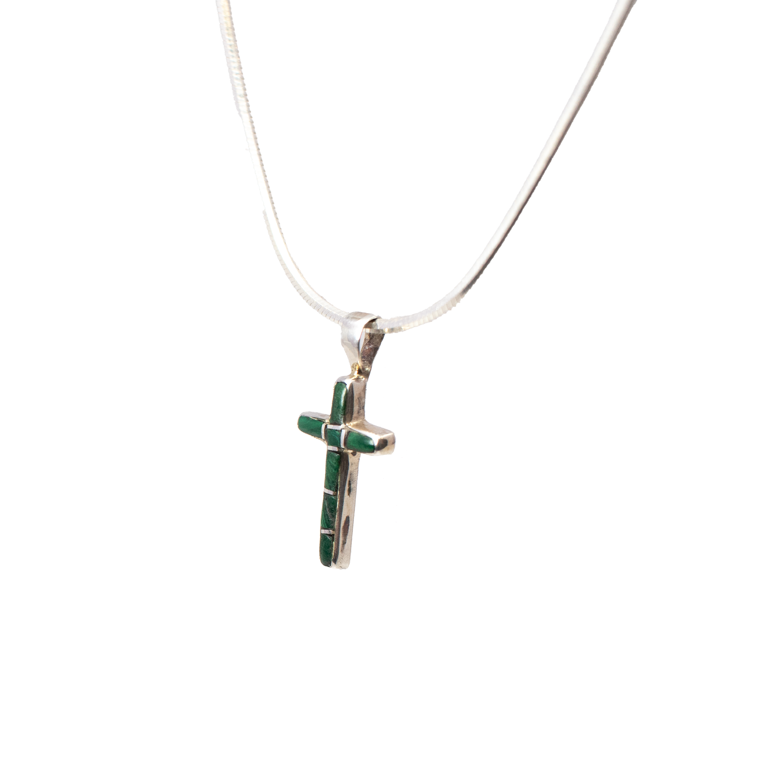 Elevate your jewelry collection with the exquisite Malachite Inlay Cross Pendant, a harmonious blend of elegance and simplicity. This mini cross pendant is meticulously crafted to capture attention with its refined design, featuring a dazzling rectangle of vibrant malachite inlay framed by a polished 925 sterling silver bezel.The cross silhouette is adorned with a sleek, simple rectangle of genuine malachite, showcasing the rich green hues and natural banding unique to this captivating gemstone. Encased in a lustrous sterling silver bezel, the pendant guarantees durability while ensuring the malachite shines brilliantly, making it the perfect statement piece for any occasion. Malachite Inlay Cross Pendant - Mini Cross With Simple Rectangle Inlay & Silver Bezel