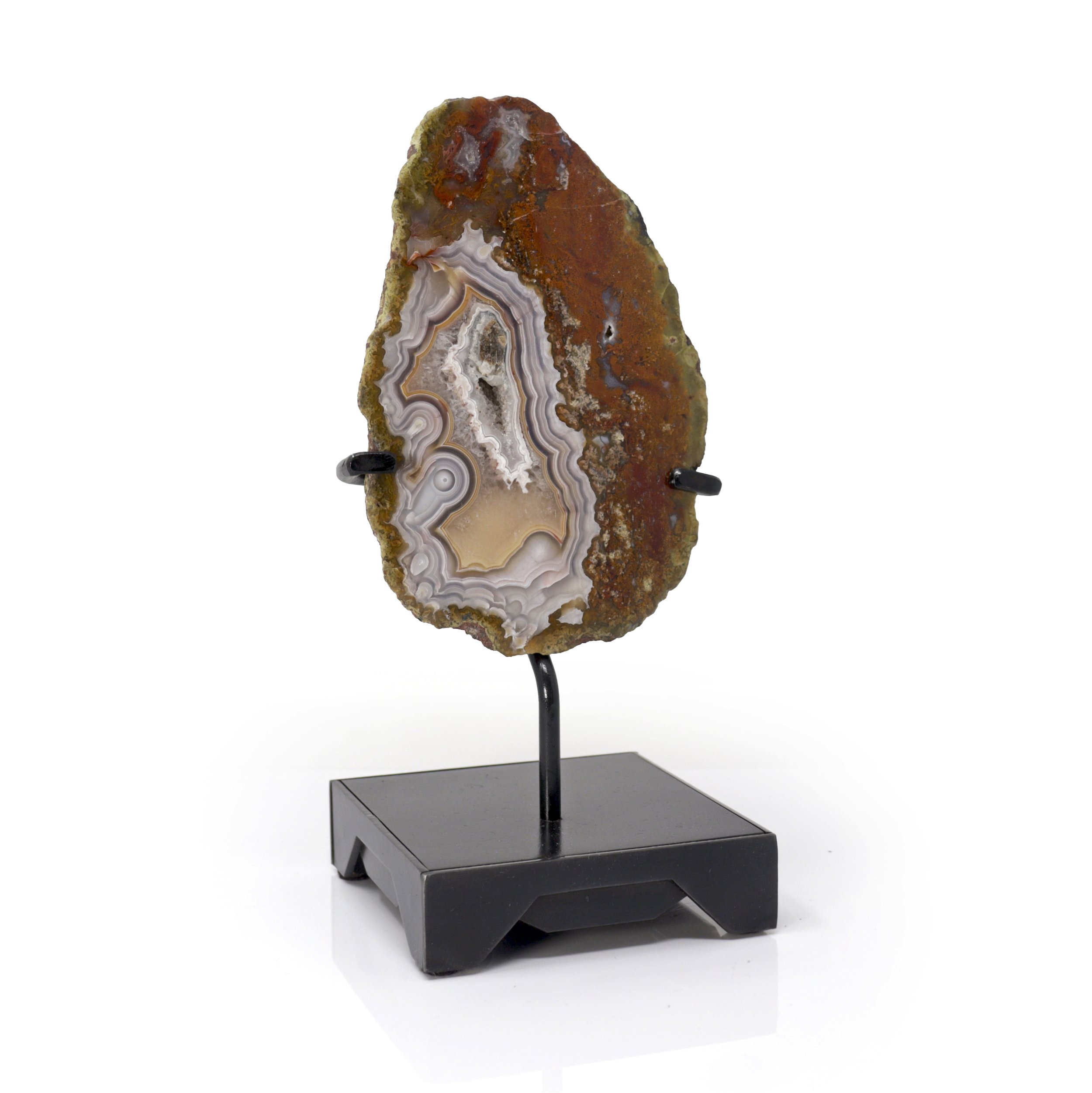 Agua Nueva Agate Geode On A Custom Black Square Stand With Trapezoidal Designs - Gray And Beige With A Small Druze Pocket