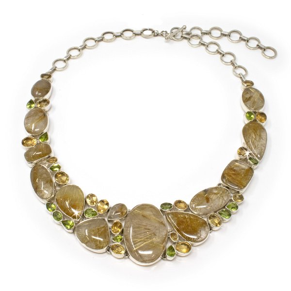 Closeup photo of Golden Rutile Quartz Necklace With Faceted Citrine & Peridot - Large Geometric Cabochons With Matrix Of Faceted Peridot & Citrine With Silver Bezels & Adjustable Toggle Clasp