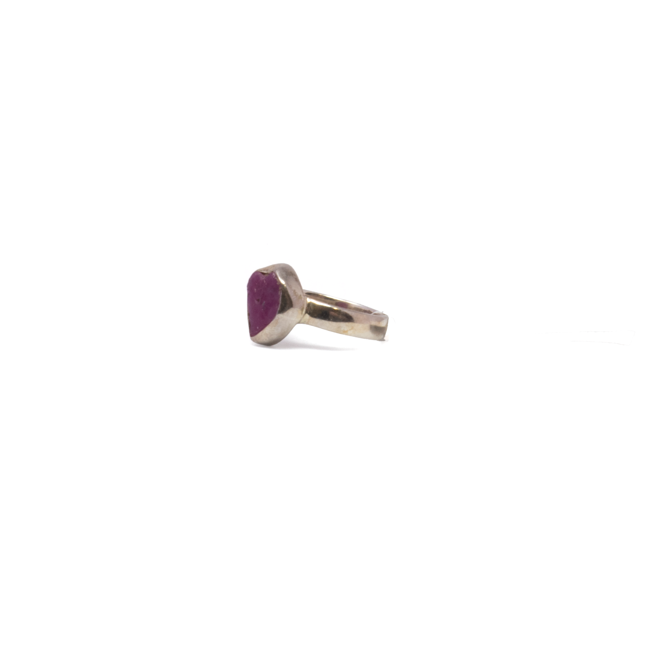 Raw yet refined, this handcrafted Ruby Ring features a natural freeform ruby set in a minimalist 925 sterling silver bezel. The organic shape and vivid pink-red hues of the stone are left untouched, allowing its natural beauty to take center stage. Sized at 5, it’s a striking yet understated piece—perfect for everyday wear or as a subtle statement on special occasions. A timeless addition to any jewelry collection, this ring celebrates the elegance of imperfection and the power of simplicity. Ruby Ring - Natural Freeform With Simple Silver Bezel Sz5