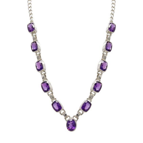 Closeup photo of Faceted Amethyst Necklace - 10 Rectangles With 1 Oval Centerpiece Set In Simple Silver Bezels