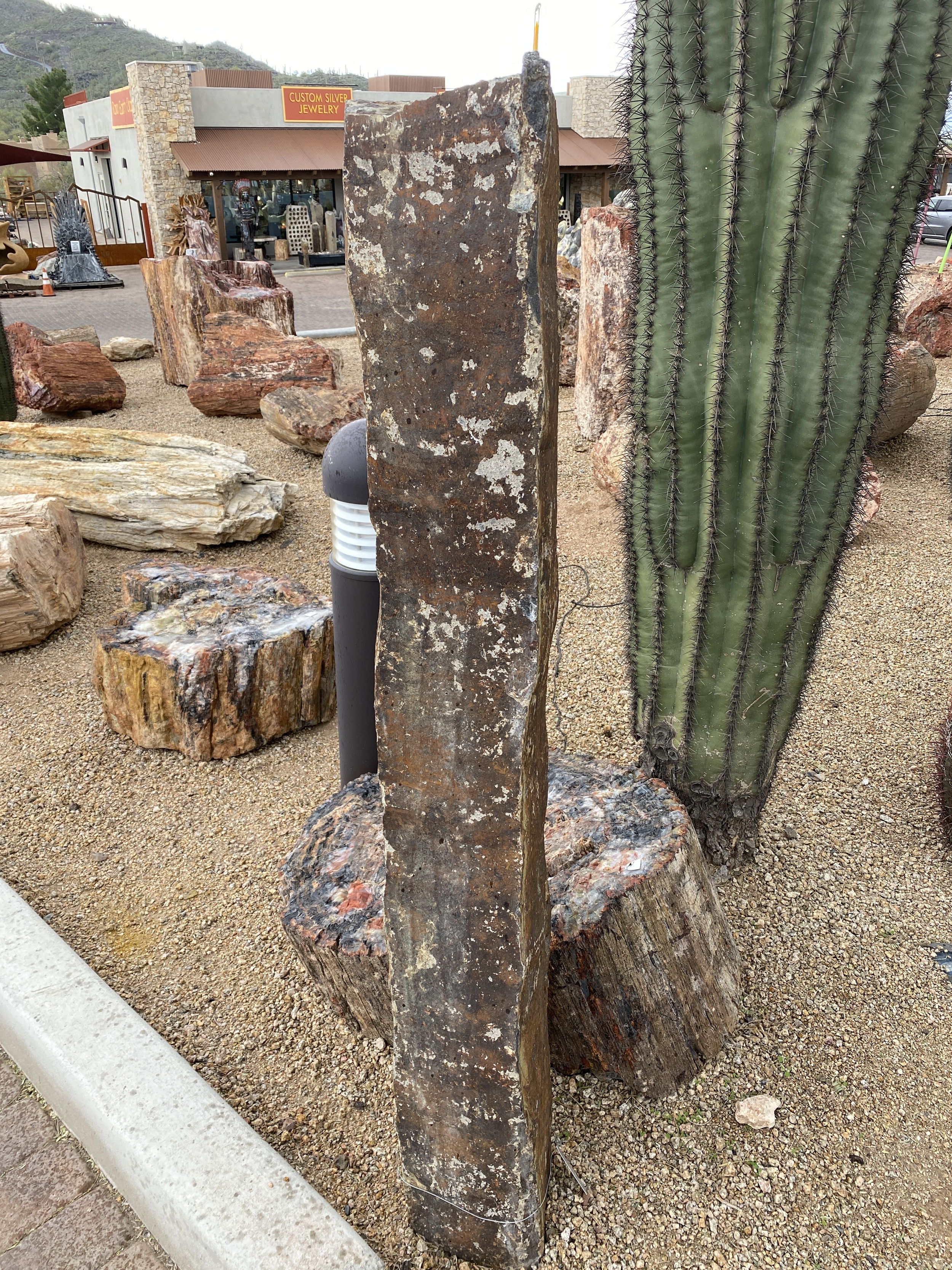 The Gold Creek Basalt Column 5' Fountain is a visually stunning addition for your yard, garden, or patio that brings tranquility and enhances the aesthetics of any space. Crafted from premium basalt, this fountain exudes a sense of natural beauty, creating a serene ambiance for relaxation and enjoyment. Let Rare Earth Gallery’s white-glove service make your fountain dreams come true—simply choose your fountain, tell us where it goes, and we’ll handle the rest, from delivery to installation. IMPORTANT: the purchase price listed is for the FOUNTAIN ONLY and DOES NOT INCLUDE the cost of a basin, pump, parts or installation. Before purchasing a fountain online, we STRONGLY recommend you call us at (480) 575-4360 for a FREE consultation to discuss these additional costs and schedule a pre-site inspection. Also, free shipping does NOT apply to fountains, please call for a quote. Gold Creek Basalt Column 5' Fountain