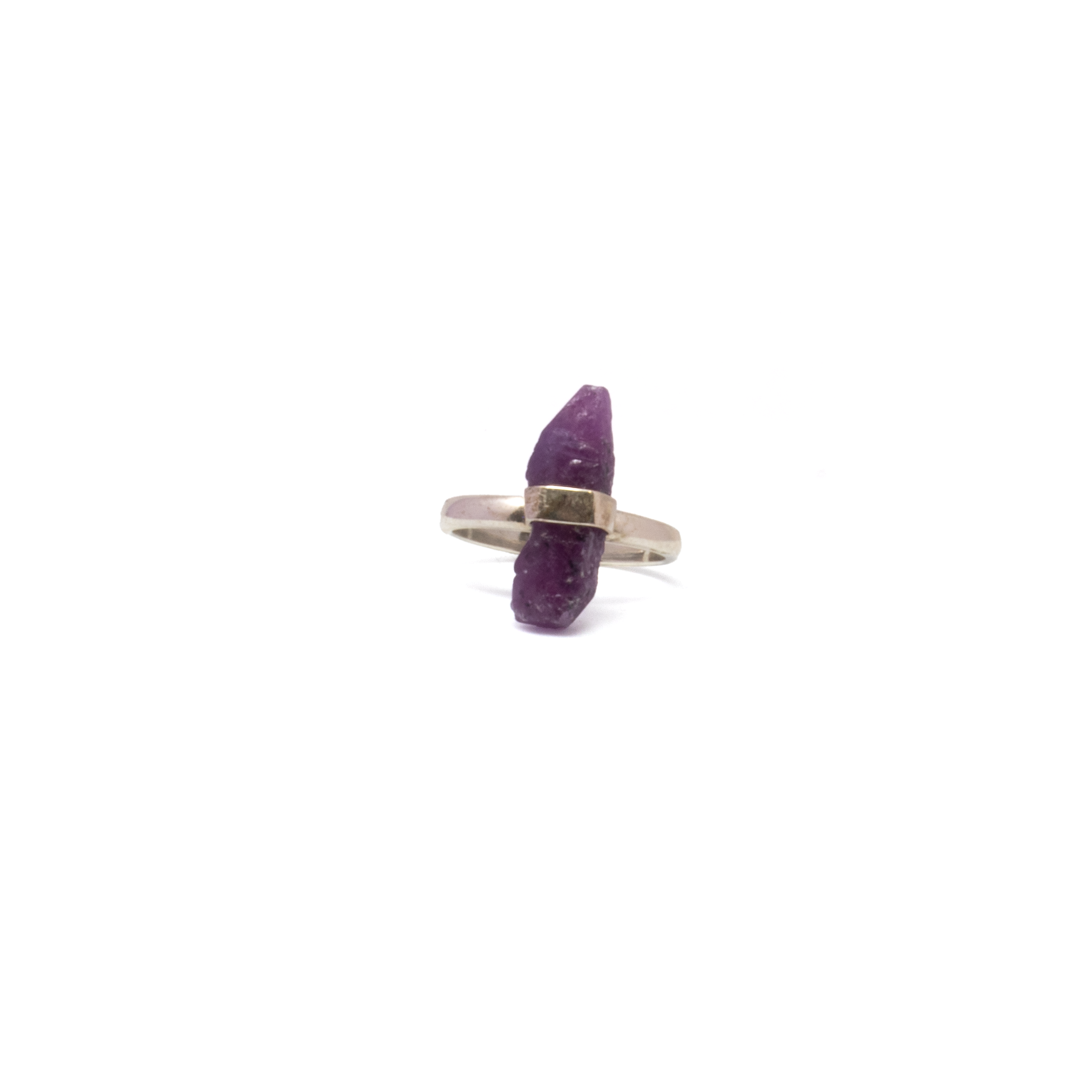 Bold in color and clean in design, this handcrafted Ruby Ring features a natural beryl crystal with rich ruby-red tones, set in a minimalist 925 sterling silver bezel. The freeform cut showcases the gem’s raw character, while the polished silver setting adds a refined edge. Sized at 7, it’s a versatile piece—equally suited for everyday wear or making an understated statement. A striking blend of natural beauty and modern craftsmanship, this ring brings depth, warmth, and timeless elegance to any jewelry collection. Ruby Ring - Natural Beryl Crystal Set In Silver Bezel Sz7