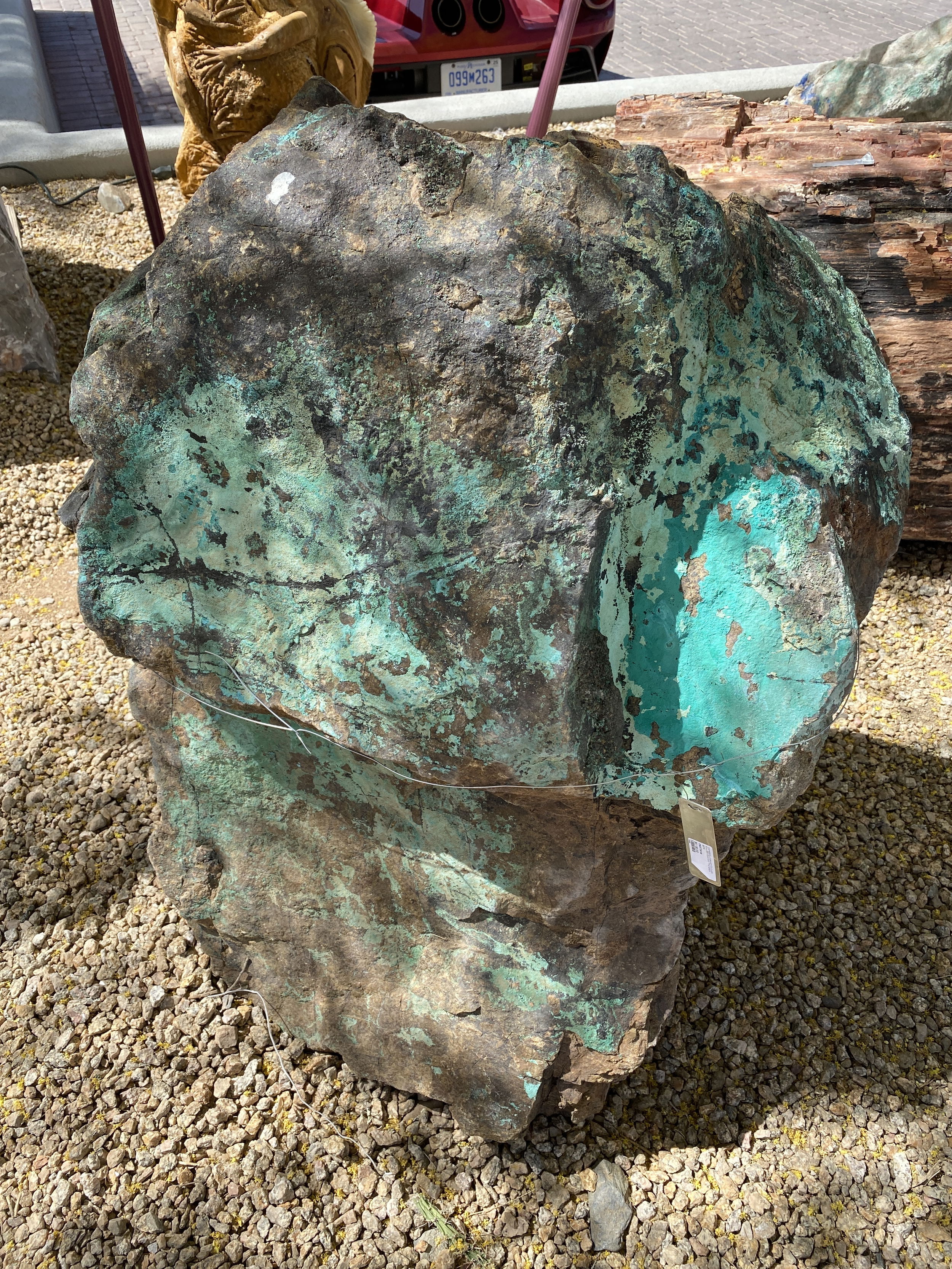 The Chrysocolla Malachite Black Boulder Fountain enhances any outdoor space with its tranquil and visually appealing design. This captivating fountain brings a sense of calm and adds beauty to your yard, garden, or patio. Let Rare Earth Gallery’s white-glove service make your fountain dreams come true—simply choose your fountain, tell us where it goes, and we’ll handle the rest, from delivery to installation. IMPORTANT: the purchase price listed is for the FOUNTAIN ONLY and DOES NOT INCLUDE the cost of a basin, pump, parts or installation. Before purchasing a fountain online, we STRONGLY recommend you call us at (480) 575-4360 for a FREE consultation to discuss these additional costs and schedule a pre-site inspection. Also, free shipping does NOT apply to fountains, please call for a quote. Chrysocolla Malachite Black Boulder Fountain