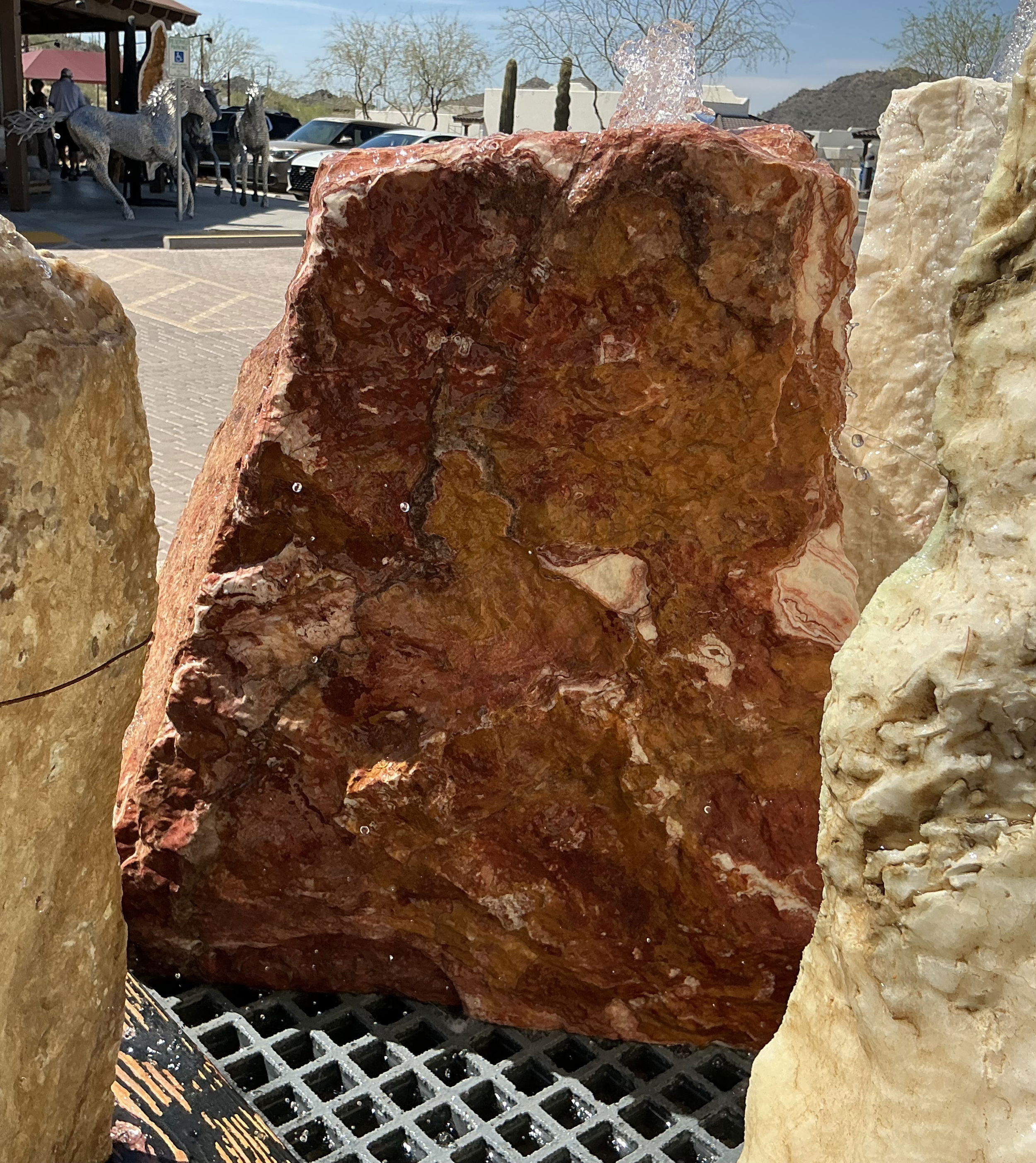 The Rosa Onyx Fountain features a striking design with a single cut side, creating a serene atmosphere and enhancing the visual appeal of any yard, garden, or patio. It brings tranquility and aesthetic beauty to outdoor spaces, making it a must-have for creating a peaceful and visually pleasing environment. Let Rare Earth Gallery’s white-glove service make your fountain dreams come true—simply choose your fountain, tell us where it goes, and we’ll handle the rest, from delivery to installation. IMPORTANT: the purchase price listed is for the FOUNTAIN ONLY and DOES NOT INCLUDE the cost of a basin, pump, parts or installation. Before purchasing a fountain online, we STRONGLY recommend you call us at (480) 575-4360 for a FREE consultation to discuss these additional costs and schedule a pre-site inspection. Also, free shipping does NOT apply to fountains, please call for a quote. Rosa Onyx Fountain With 1 Cut Side