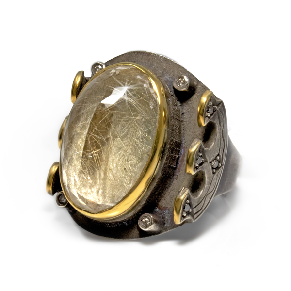 Closeup photo of Golden Rutile Ring - Reverse Set Facet Oval on Oxidized Medieval Style Band with Diamonds & Gold Vermeil Accents Size 9.5