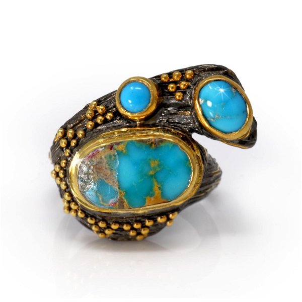 Closeup photo of Persian Turquoise Ring Size 7.5 - 2 Oval Cabochons & 1 Round Cabochon With Gold Vermeil Bezels & Beading On Branching Wood Grain Stamped Oxidized Sterling Silver Band With Gold Accents
