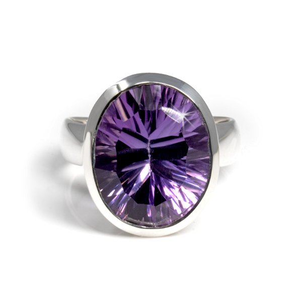 Closeup photo of Faceted Amethyst Ring - Oval With Tall Tapered Silver Bezel & Laser Cut Facet Size 10