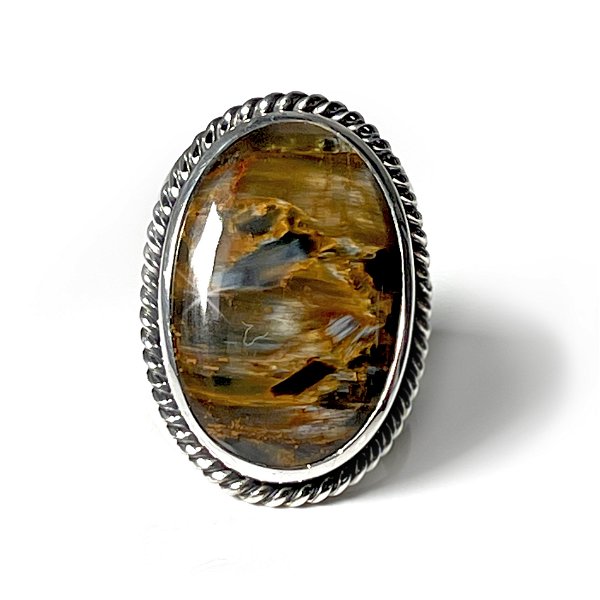Closeup photo of Pietersite Ring Size 11- Oval Cabochon On Raised Silver Bezel With Rope Stamped Edge On Tapered Wide Band