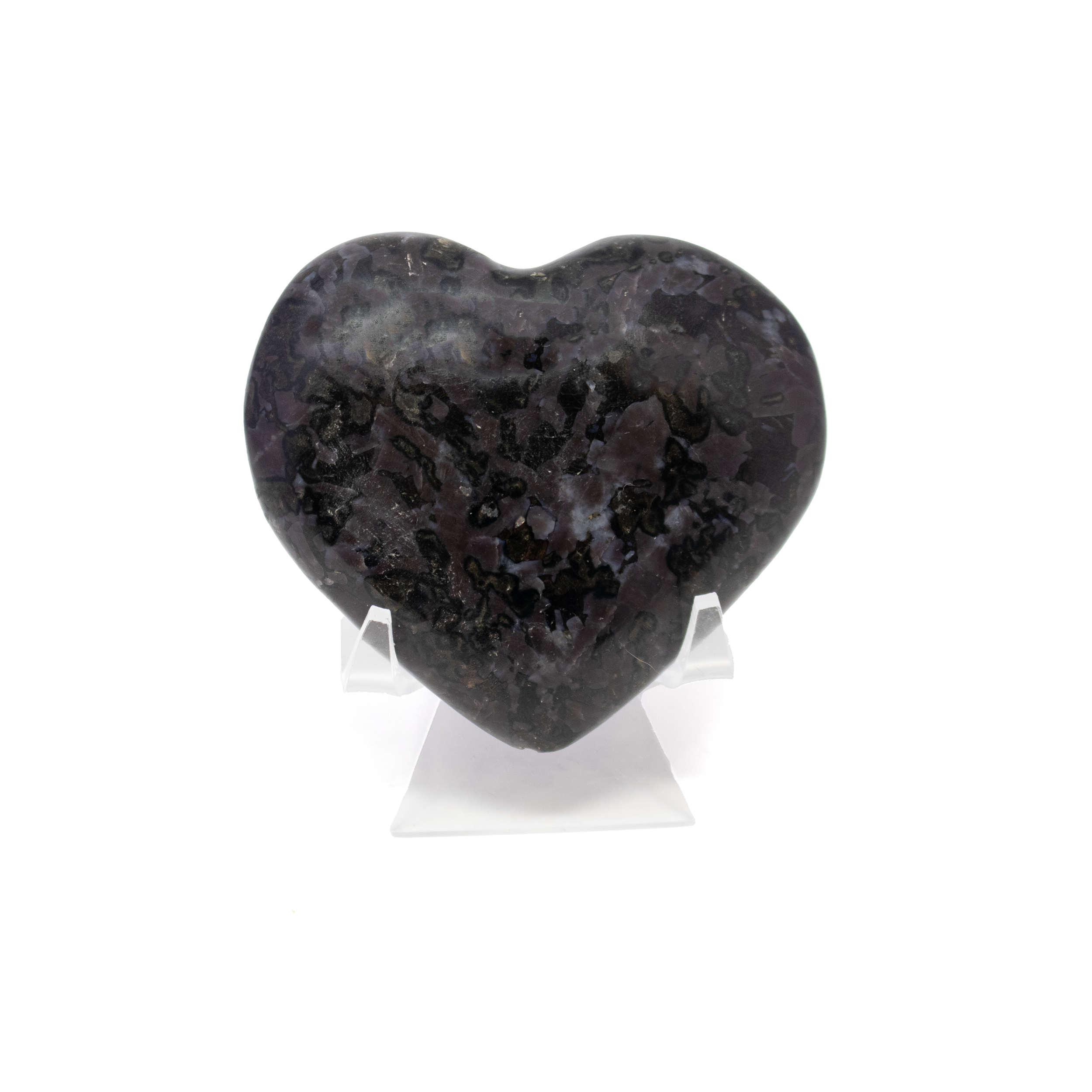 Embrace the captivating energy of the Indigo Gabbro Heart—a stunning mineral specimen expertly carved into a smooth, palm-sized heart. Indigo Gabbro, also known as "Mystic Merlinite," features mesmerizing swirls of deep indigo, gray, and black, creating a one-of-a-kind pattern in every piece. Revered for its grounding and intuitive properties, this heart-shaped stone makes a thoughtful gift for mineral collectors, spiritual practitioners, or anyone drawn to its natural beauty. Keep it close during meditation, display it on your altar, or carry it as a symbol of inner strength and transformation. Indigo Gabbro Heart