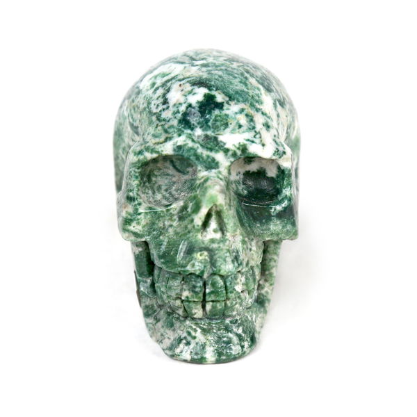 Closeup photo of Moss Agate Skull Carving