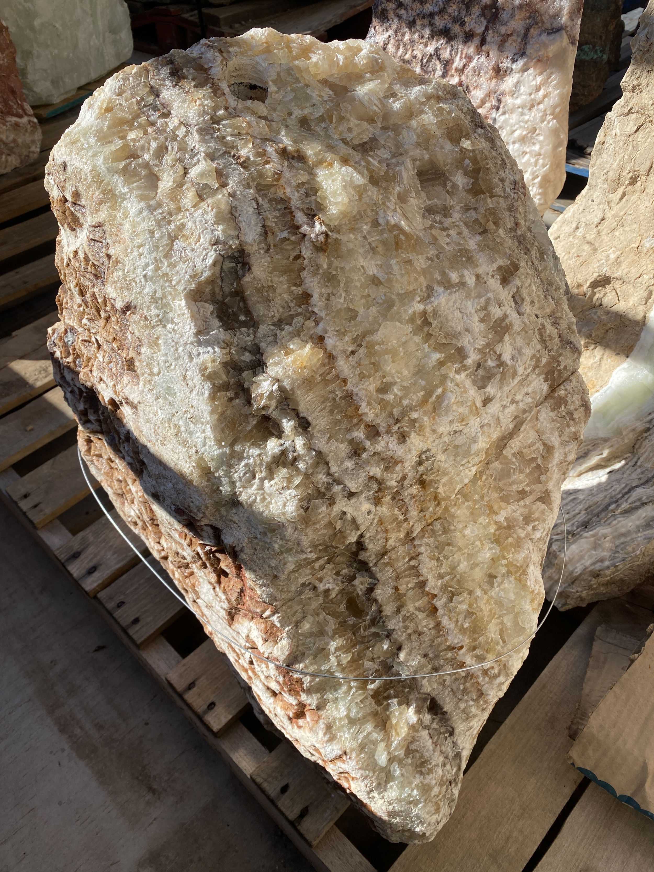 This Serpentine Onyx Rough Boulder Fountain adds a touch of Zen to any outdoor space. Its natural beauty and calming water sounds create a tranquil atmosphere that enhances the aesthetic appeal of your yard, garden, or patio. Let Rare Earth Gallery’s white-glove service make your fountain dreams come true—simply choose your fountain, tell us where it goes, and we’ll handle the rest, from delivery to installation. IMPORTANT: the purchase price listed is for the FOUNTAIN ONLY and DOES NOT INCLUDE the cost of a basin, pump, parts or installation. Before purchasing a fountain online, we STRONGLY recommend you call us at (480) 575-4360 for a FREE consultation to discuss these additional costs and schedule a pre-site inspection. Also, free shipping does NOT apply to fountains, please call for a quote. Serpentine Onyx Rough Boulder Fountain