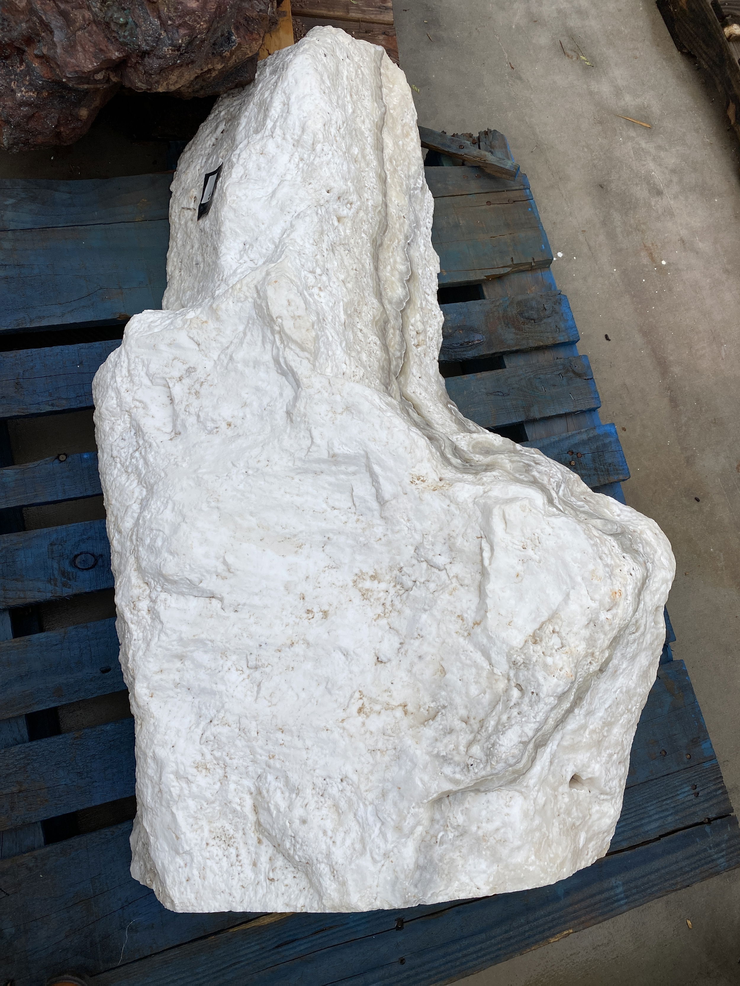 Nube Onyx Freeform Fountain enhances outdoor spaces with its elegant design, creating a serene and visually appealing atmosphere. Its unique cut side adds an artistic touch, fostering tranquility in gardens, yards, or patios. Let Rare Earth Gallery’s white-glove service make your fountain dreams come true—simply choose your fountain, tell us where it goes, and we’ll handle the rest, from delivery to installation. IMPORTANT: the purchase price listed is for the FOUNTAIN ONLY and DOES NOT INCLUDE the cost of a basin, pump, parts or installation. Before purchasing a fountain online, we STRONGLY recommend you call us at (480) 575-4360 for a FREE consultation to discuss these additional costs and schedule a pre-site inspection. Also, free shipping does NOT apply to fountains, please call for a quote. Nube Onyx Freefrom Fountain With 1 Cut Side