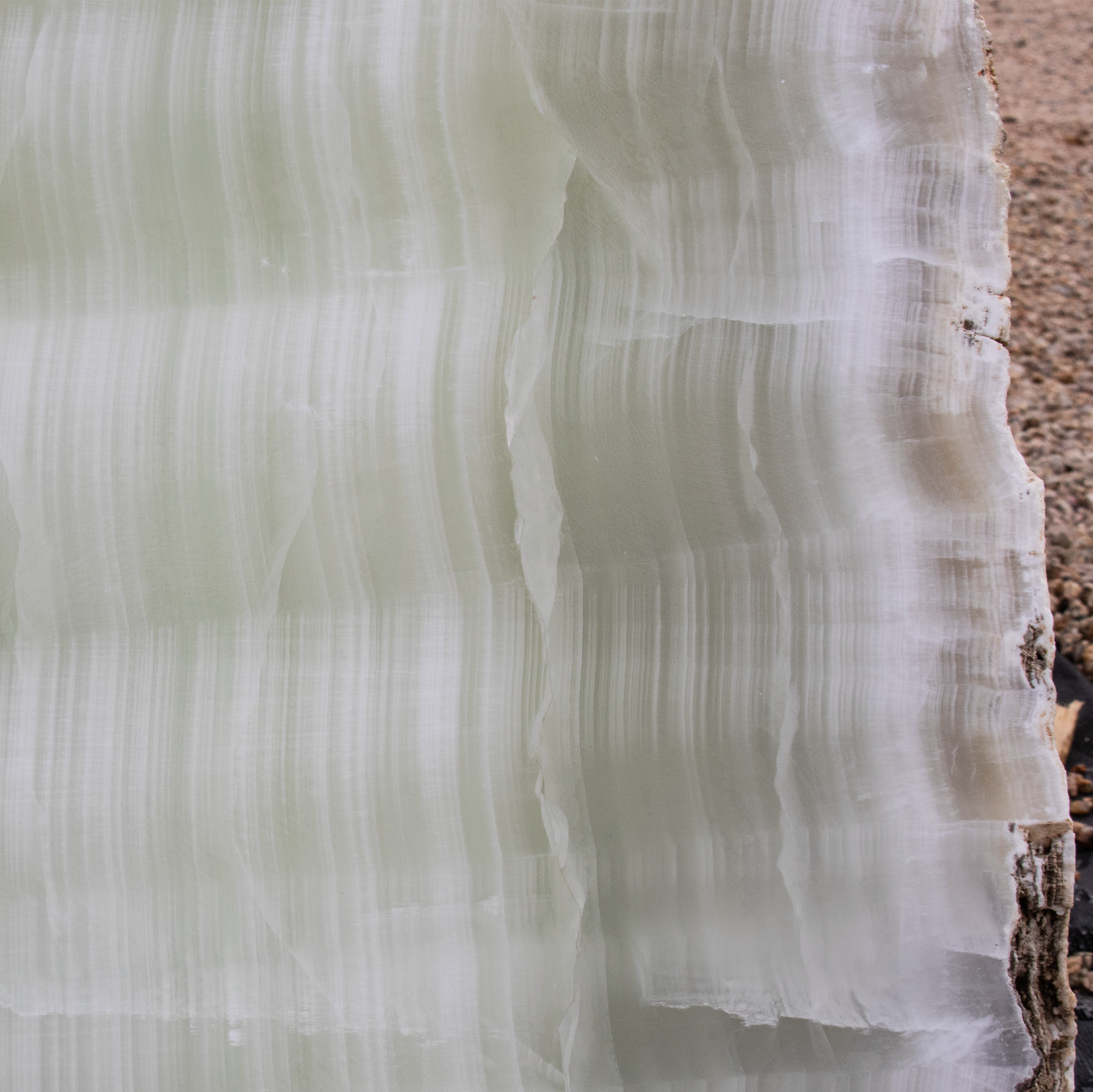 The Green Pearlescent Onyx Wedge Fountain with 3 Holes creates a peaceful and visually attractive outdoor space for your yard, garden, or patio. Enjoy the tranquility it brings while enhancing the overall aesthetic of your outdoor area. Let Rare Earth Gallery’s white-glove service make your fountain dreams come true—simply choose your fountain, tell us where it goes, and we’ll handle the rest, from delivery to installation. IMPORTANT: the purchase price listed is for the FOUNTAIN ONLY and DOES NOT INCLUDE the cost of a basin, pump, parts or installation. Before purchasing a fountain online, we STRONGLY recommend you call us at (480) 575-4360 for a FREE consultation to discuss these additional costs and schedule a pre-site inspection. Also, free shipping does NOT apply to fountains, please call for a quote. Green Pearlescent Onyx Wedge Fountain With 3 Holes