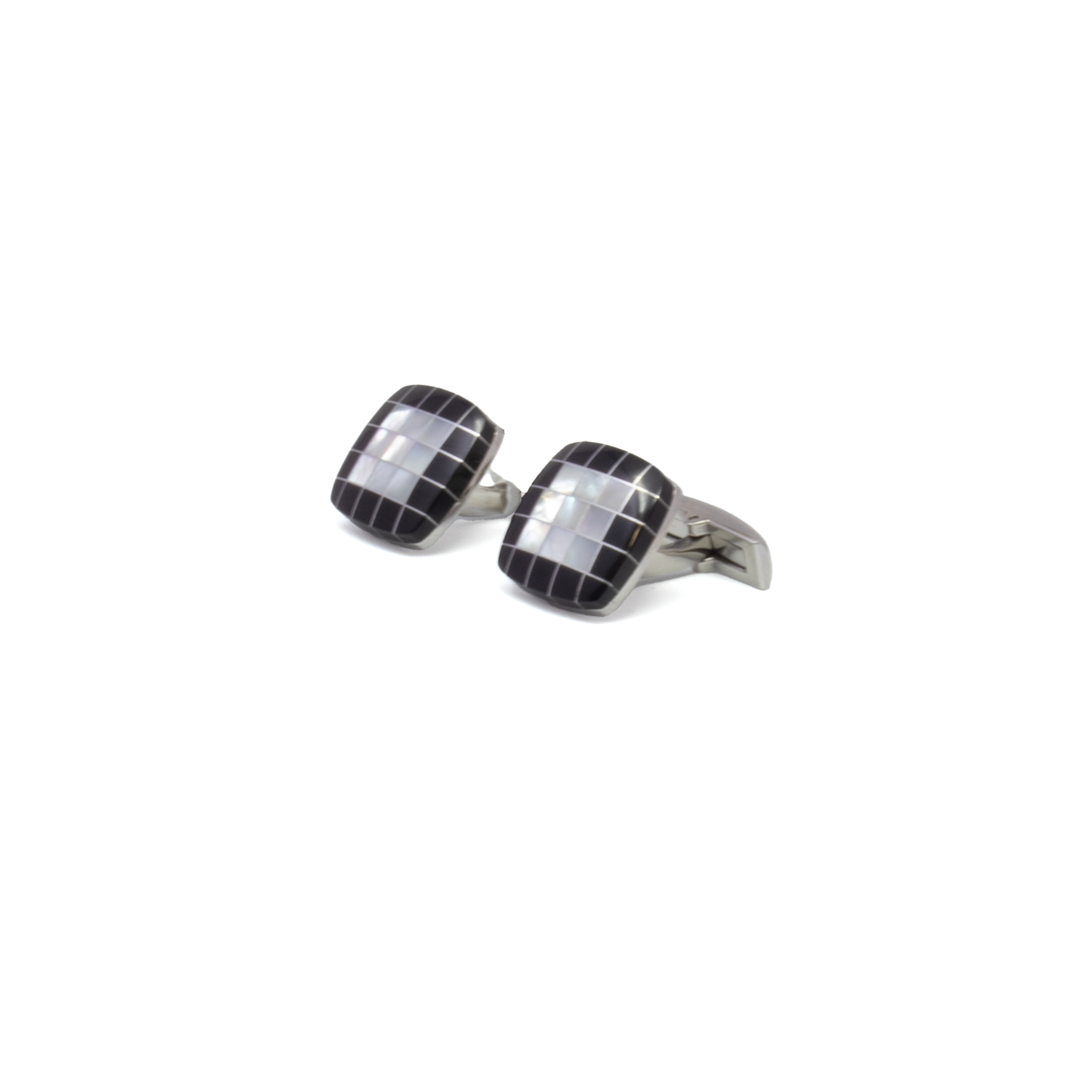 Elevate your formal ensemble with these Mother of Pearl & Black Onyx Checkerboard Cufflinks, crafted in polished stainless steel for a sleek, enduring finish. The bold checkerboard design pairs luminous mother of pearl with deep black onyx, creating a refined contrast that catches the eye. Perfect for weddings, business occasions, or elegant evenings out, these cufflinks blend timeless elegance with contemporary edge—an essential detail for the discerning gentleman. Mother Of Pearl & Black Onyx Checkerboard Stainless Steel Cufflinks