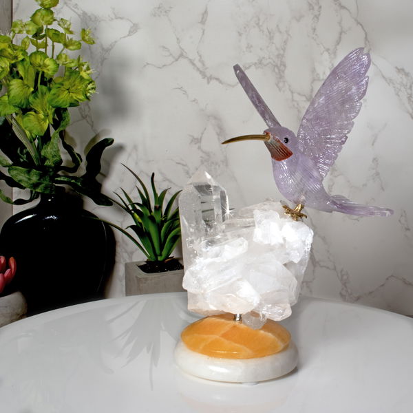 Closeup photo of Amethyst Hummingbird Perched On Quartz Cluster With Yellow Calcite & Quartz Round Base