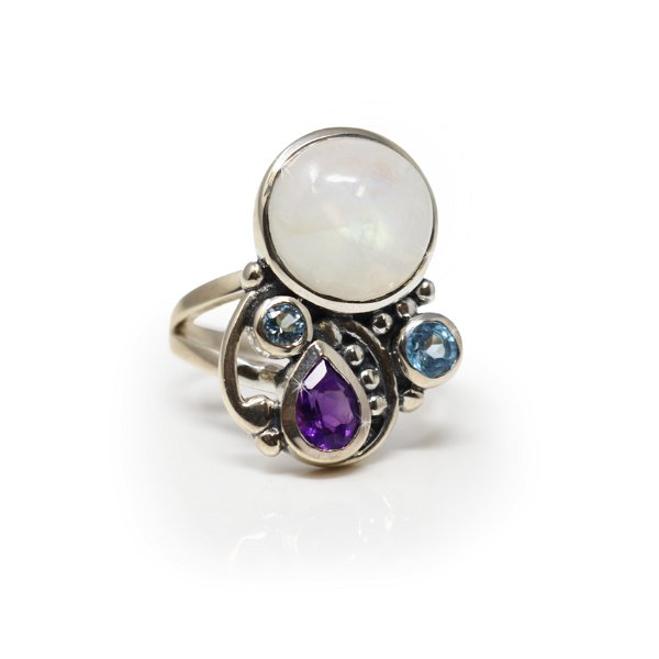 Closeup photo of Rainbow Moonstone Ring - Round Cabochon With Faceted Amethyst Pear & Faceted Blue Topaz Rounds With 925 Sterling Silver Bezels With Beading On Open Band Sz8