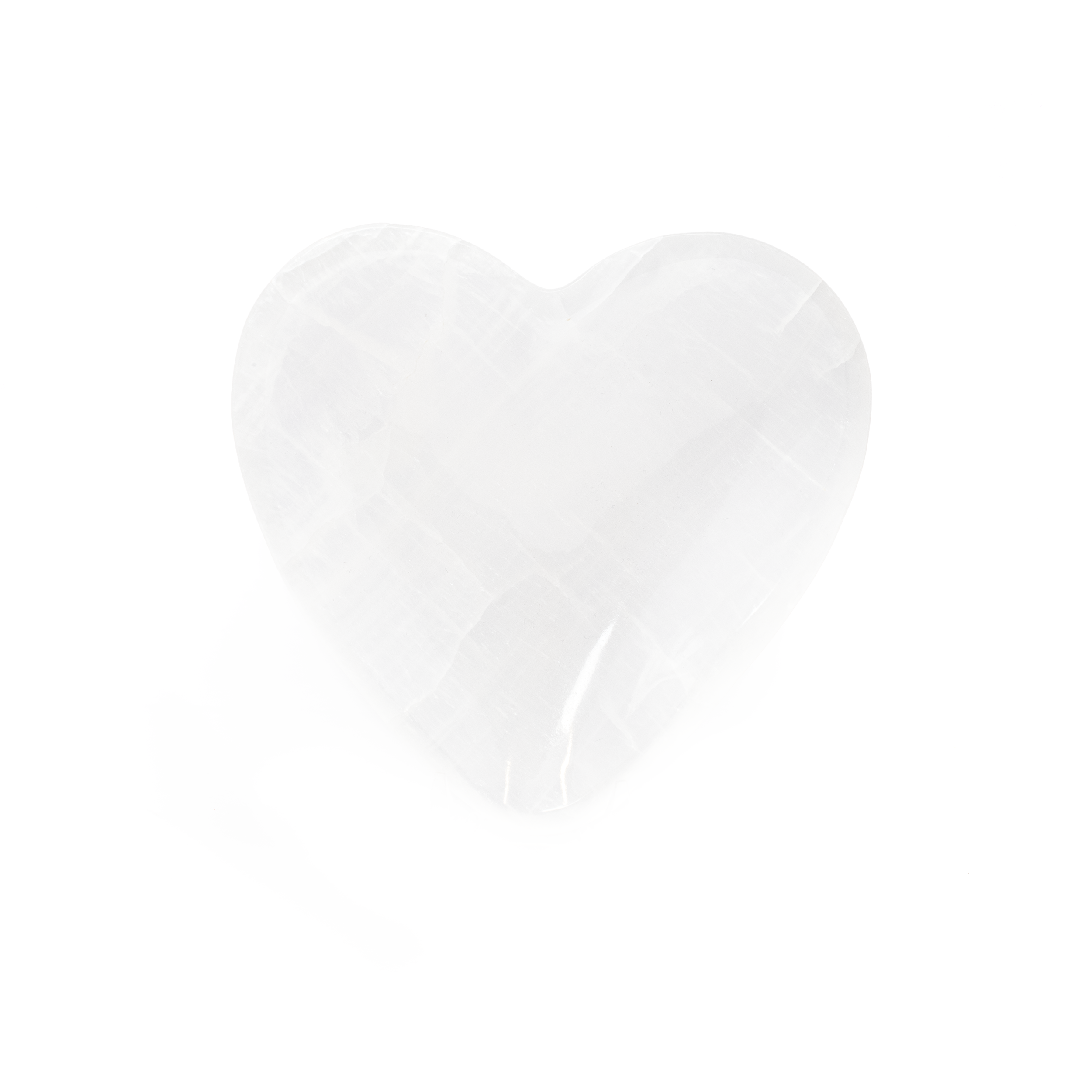 Elevate your home decor with the captivating allure of our Ice White Onyx Heart Vessel. Expertly crafted from premium Mexican Onyx, this stunning piece merges nature's beauty with exquisite craftsmanship, making it a perfect addition to any space.Each vessel is a homage to the skilled artisans of Mexico, who meticulously shape and polish the onyx to bring out its natural luster and intricate veining. Whether you're looking to add a touch of elegance to your own home or searching for a thoughtful gift, this heart vessel is a timeless choice that embodies both grace and functionality. Ice White Onyx Heart Vessel- 5 inch