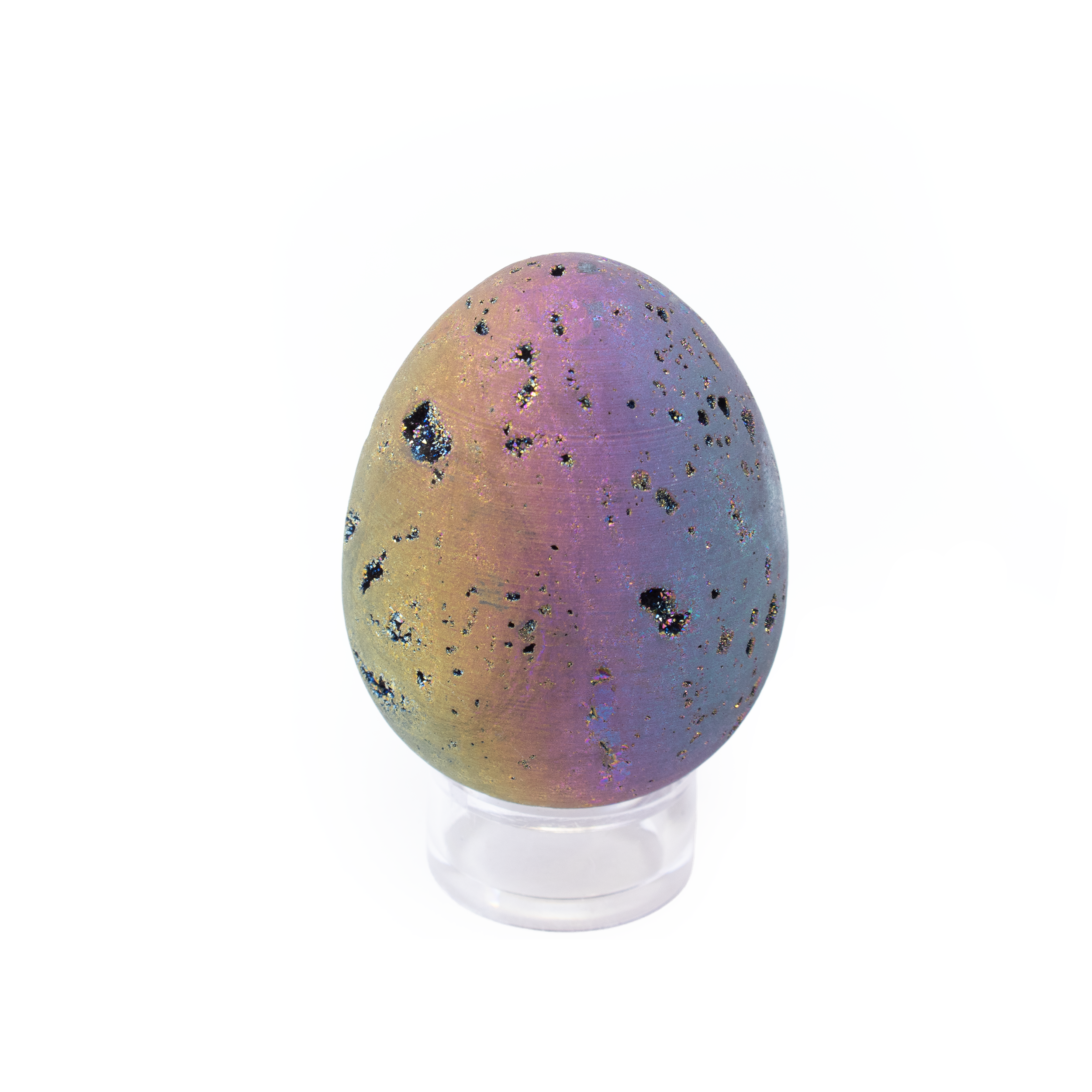 This dazzling Rainbow Titanium Druze Egg shimmers with vibrant hues of purple, blue, pink, and green—created by bonding titanium to natural druzy quartz. Its sparkling surface and smooth finish make it a striking blend of raw crystal texture and refined craftsmanship.Perfect as a statement decor piece or a gift for crystal lovers, this egg embodies beauty and energy—celebrated for promoting creativity, calm, and balance in any space. A true fusion of nature’s wonder and artistic brilliance. Rainbow Titanium Druze Egg