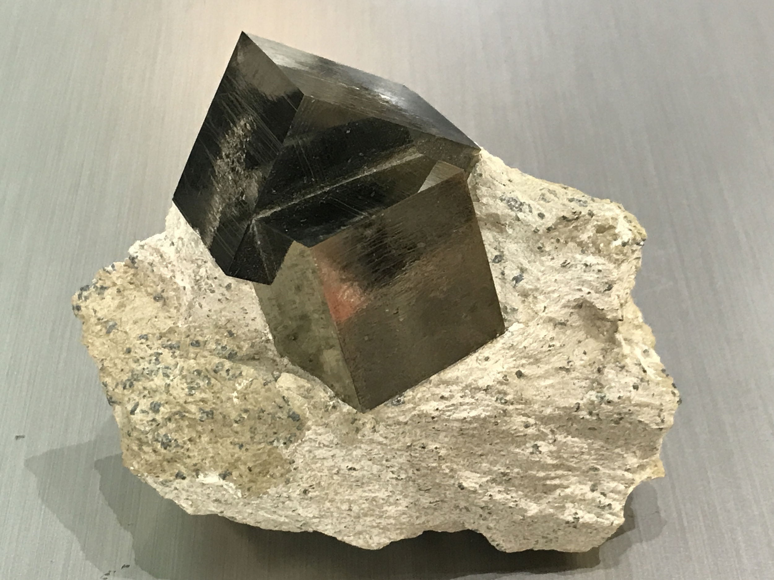 Cubic Pyrite Bonded in Matrix on Lucite Stand