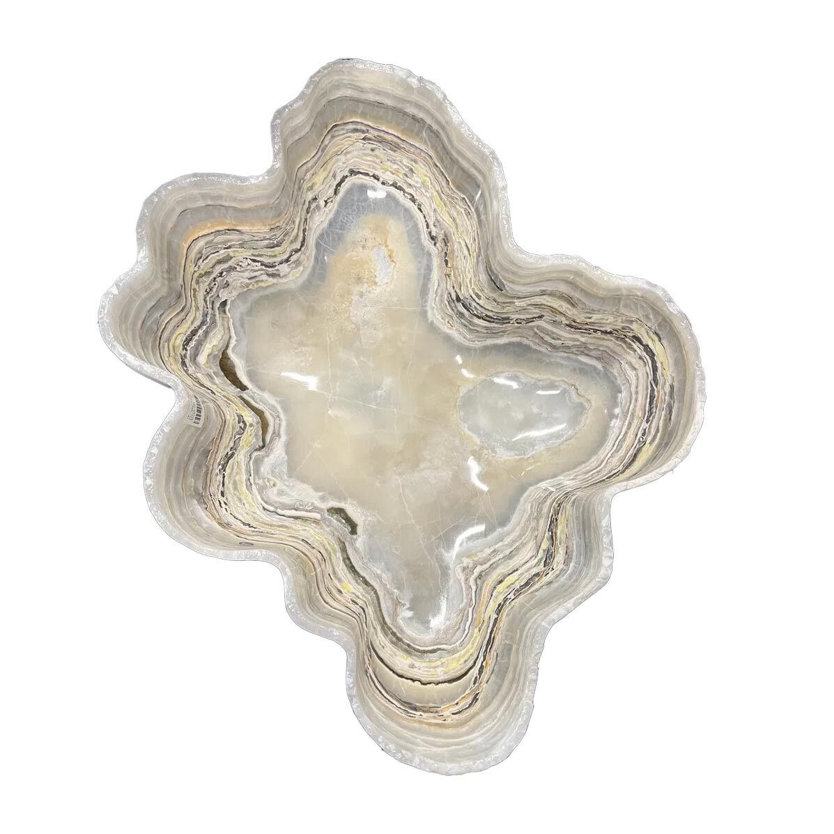 Carved from deep-veined Mexican onyx and kissed with an iridescent shimmer, the Pearlescent Onyx Vessel is a sculptural tribute to the elegance of stone and light. Dark, moody hues ripple across its surface, illuminated by unexpected flashes of pearlescence that shift and glow as the light moves. No two pieces are alike—each vessel is a singular expression of nature’s artistry and human touch.Polished to a satin gloss and shaped with reverence for the material’s natural form, this onyx bowl offers a refined yet organic presence. Ideal as a standalone accent or as a cradle for curated treasures, it brings a quiet opulence to any room—sublime on a console, commanding as a centerpiece, and evocative wherever it rests. Pearlescent Onyx Vessel