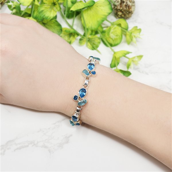 Closeup photo of Blue Topaz Link Bracelet - 7 Faceted Pears with 14 Rough Blue Apatite Freeforms & 925 Sterling Silver Bezels