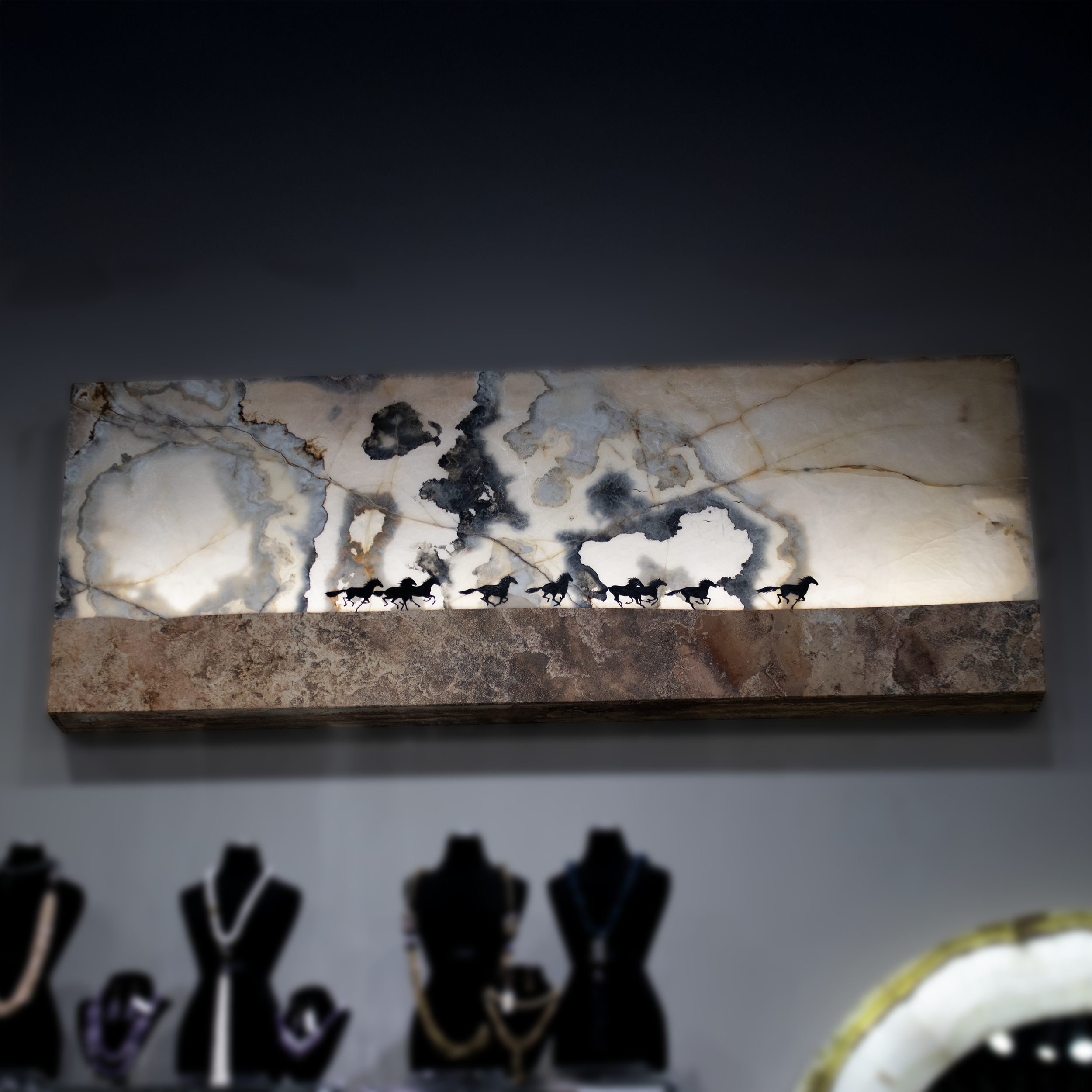 Transform your living space with the breathtaking beauty of the Onyx Animal Panel featuring "Horses Running." This exquisite piece of wall art serves as both a captivating focal point and an elegant source of ambient lighting, making it a perfect addition to any home or office.Crafted from premium Mexican Onyx, the panel showcases the natural translucence and rich, earthy tones of this exceptional material. The intricate design captures the dynamic grace and power of horses in motion, bringing a sense of vitality and elegance to your decor. Each piece is unique, with distinctive patterns that highlight the innate beauty of onyx and tell their own story.The Onyx Animal Panel is not just a work of art; it also serves as a functional lighting element. The integrated illumination enhances the panel's enchanting features, casting a warm, inviting glow that adds depth and atmosphere to any setting. Whether turned on or off, the panel exudes sophistication and charm. Onyx Animal Panel - Horses Running