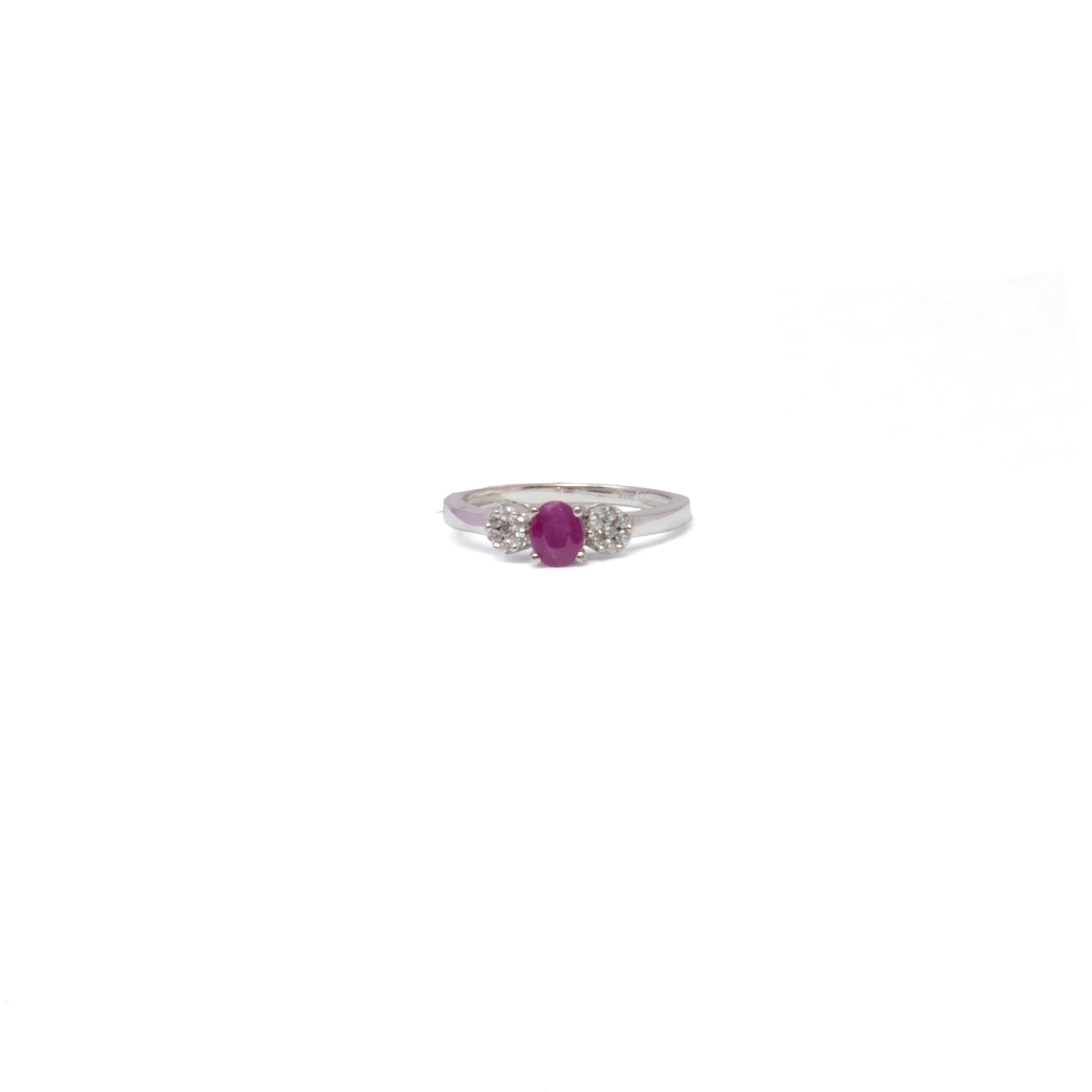 A vivid faceted oval ruby takes center stage in this elegant size 6 ring, flanked by two white cubic zirconia flowers that add sparkle and delicate detail. Set in polished 925 sterling silver, the prong setting and balanced design offer both refinement and charm. A timeless piece with a hint of whimsy—perfect for adding color and grace to any ensemble. Ruby Ring - Faceted Oval Prong Set with 2 White Czs Flowers on 925 Sterling Silver Band sz6