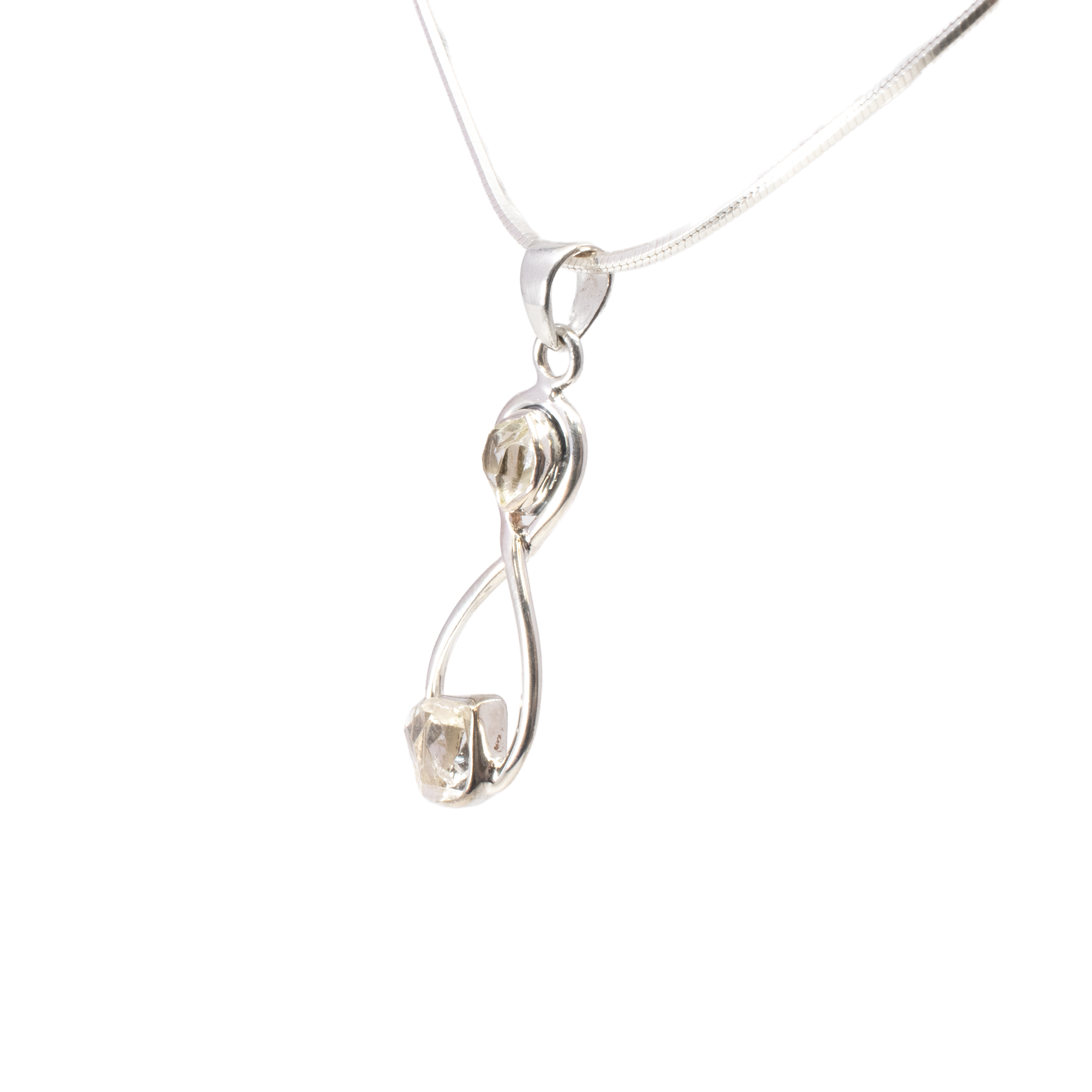 Introducing the Herkimer Diamond Pendant - Freeform Duo Set in 925 Sterling Silver Infinity Symbol, a stunning piece that seamlessly blends elegance with natural beauty. This exquisite pendant showcases two radiant Herkimer diamonds, celebrated for their clarity and raw charm, expertly set in a graceful infinity symbol crafted from premium 925 sterling silver.The freeform arrangement of the Herkimer diamonds enhances their unique, crystalline allure, making each pendant a one-of-a-kind creation. Known for their impressive sparkle and organic form, Herkimer diamonds are not only visually captivating but also cherished for their metaphysical properties, believed to promote clarity and spiritual growth. Herkimer Diamond Pendant - Freeform Duo Set in 925 Sterling Silver Infinity Symbol