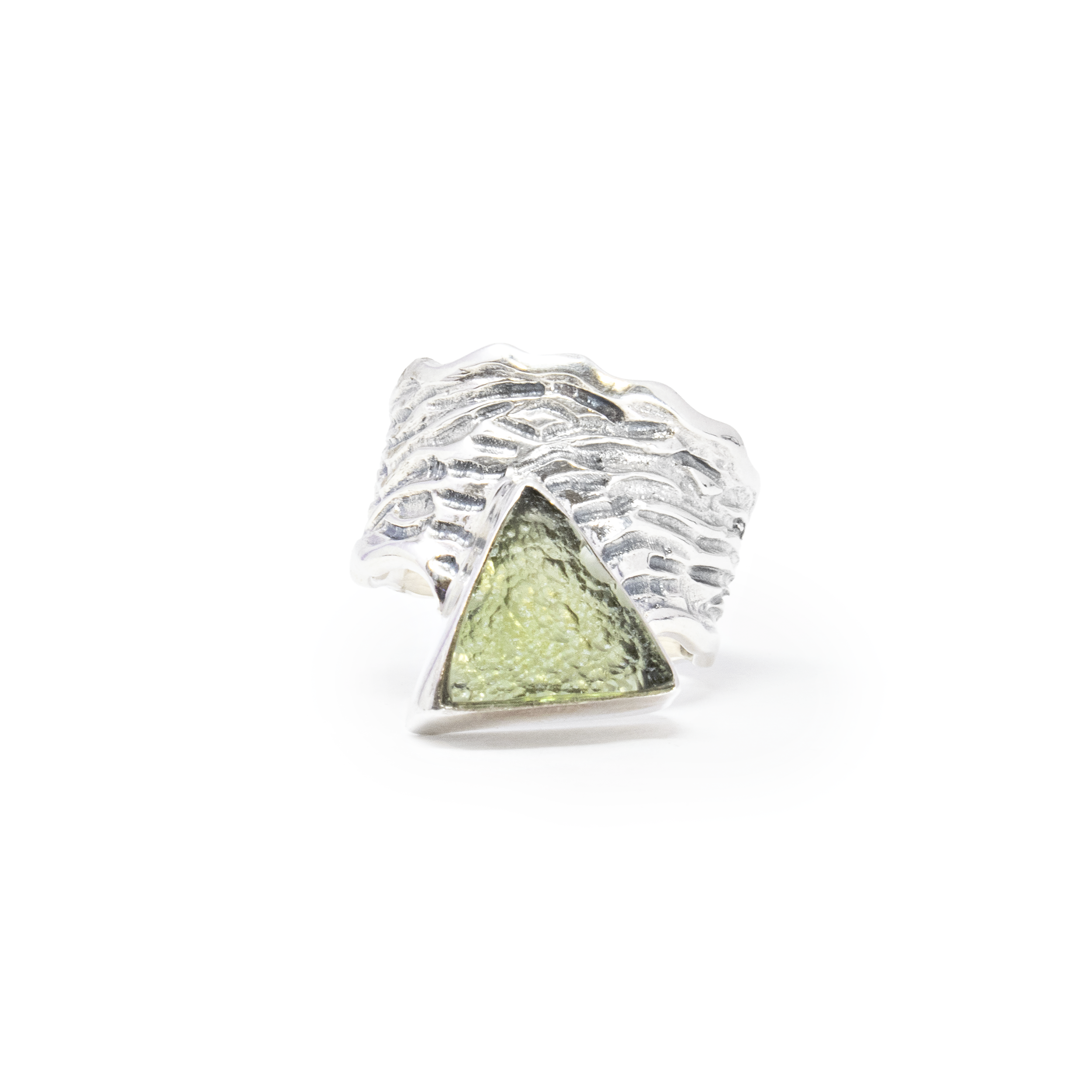 Step into the mystical allure of the cosmos with our Moldavite Triangle Nugget Ring, a unique piece that melds earthly elegance with celestial charm. This ring features an enchanting Moldavite stone, exquisitely cut into a striking triangle nugget shape and securely nestled in a sleek silver bezel setting.Crafted from premium 925 sterling silver, the ring boasts a textured open band that gracefully wraps around your finger, offering both comfort and style. The band’s wavy edge design enhances the organic appeal of the piece, mimicking the fluid, undulating forms found in nature. Moldavite Ring - Triangle Nugget with Silver Bezel Set On Textured Open Band with Wavey Edge
