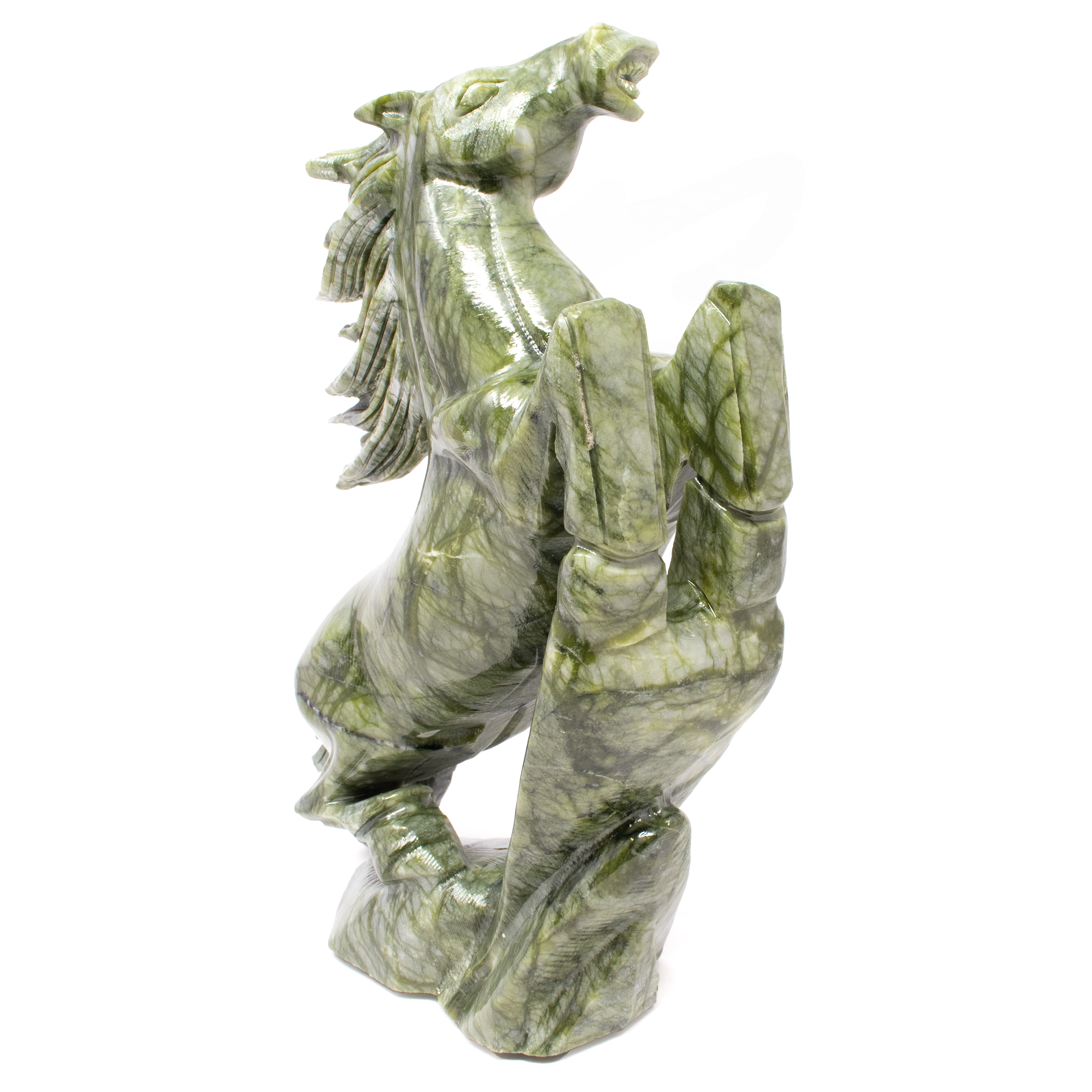 Elevate your home or office with the majestic beauty of our handcrafted Serpentine Horse Carving. This exquisite sculpture captures the dynamic essence of a horse in a rearing stance, symbolizing strength, freedom, and spirited elegance. Each piece is meticulously carved by skilled artisans from high-quality serpentine stone, renowned for its rich, natural hues and smooth finish. The attention to detail ensures a lifelike representation of a rearing horse, with intricately defined muscles and a flowing mane that conveys motion and grace. Due to the natural characteristics of serpentine, no two carvings are exactly alike, making your piece a truly unique addition to your collection. The stone's distinctive patterns and colors range from deep greens to gentle yellows, adding a touch of nature’s artistry to your decor.Beyond its visual allure, the rearing horse embodies power, resilience, and unbridled spirit, making it a meaningful gift or a profound statement piece for those who appreciate equine beauty and symbolism. Serpentine Horse Carving - Rearing