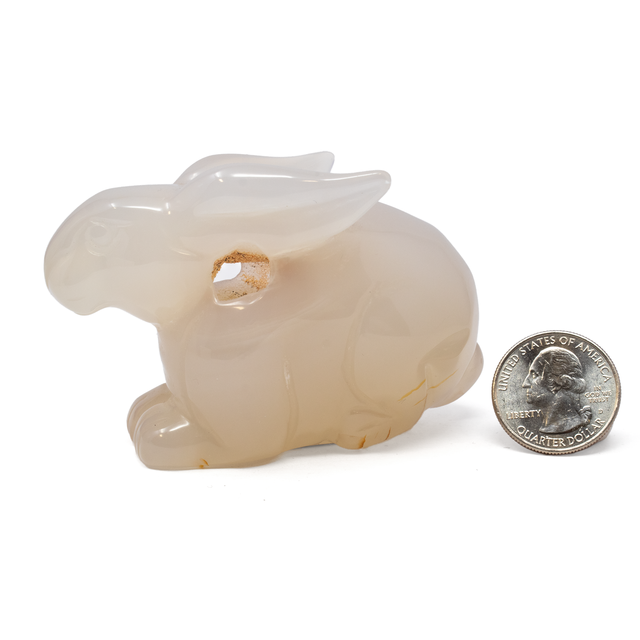 Delight in the enchanting allure of our Agate Druzy Geode Rabbit Carving, a mesmerizing fusion of nature's artistry and skilled craftsmanship. Perfect for both sculpture enthusiasts and those seeking a unique gift, this exquisite piece effortlessly combines the rich earthiness of agate with the dazzling sparkle of druzy crystals. Each rabbit carving is meticulously crafted from high-quality agate, showcasing the stone's natural bands and unique geological patterns. The calming hues of the agate, ranging from warm browns to serene blues, create an inviting and tranquil aesthetic. The piece is embedded with druzy crystals, adding a captivating shimmer that catches the light from every angle. These tiny crystals enhance the sculpture's appeal, making it a true statement piece for any room. Agate Druze Geode Rabbit Carving