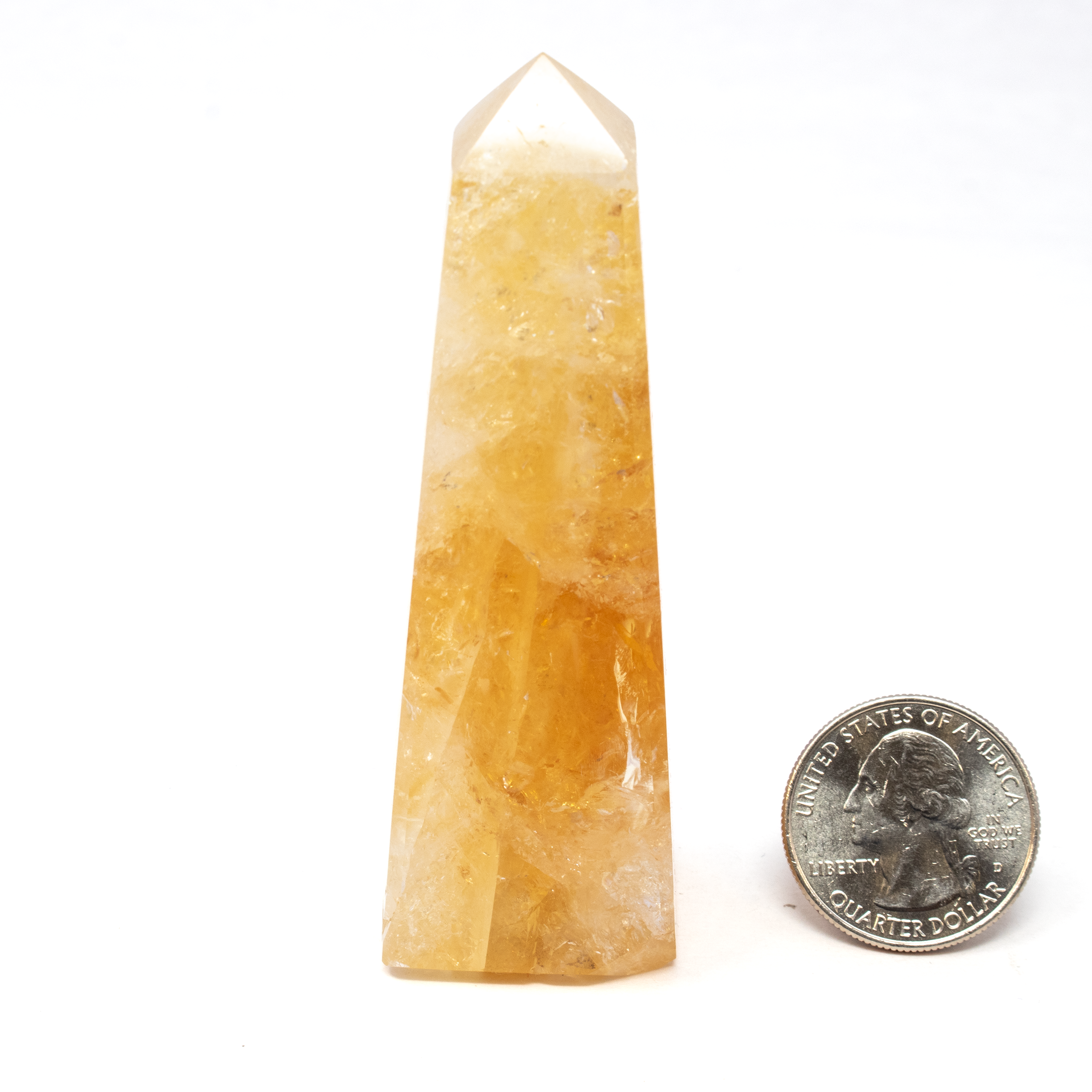 Elevate your crystal collection with our exquisite Citrine Obelisk, a quintessential piece for discerning collectors and crystal enthusiasts alike. Renowned for its radiant energy and stunning golden hues, this captivating specimen not only enhances aesthetic appeal but also brings a sense of warmth and positive energy to any space.Hand-selected for its clarity and vibrant coloration, this obelisk epitomizes the beauty and power of natural citrine.The obelisk shape is carefully crafted to focus and radiate energy, aligning perfectly with principles of balance and harmony in crystal healing practices. Citrine Obelisk