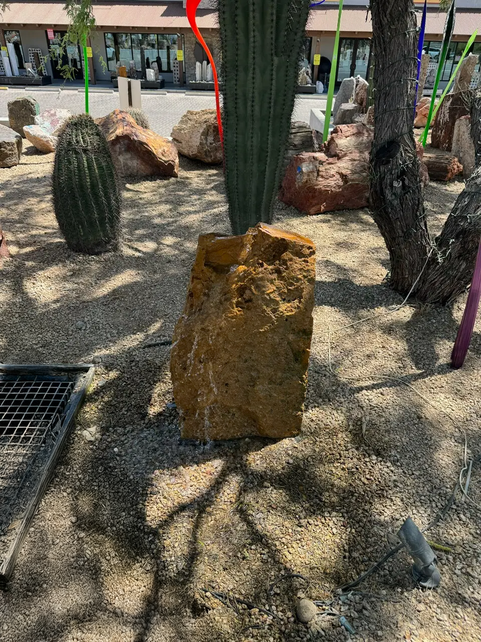This red travertine fountain features a cut side design that adds a touch of elegance to any outdoor space. Its soothing sound and visually appealing appearance create a tranquil atmosphere for your yard, garden, or patio. Let Rare Earth Gallery’s white-glove service make your fountain dreams come true—simply choose your fountain, tell us where it goes, and we’ll handle the rest, from delivery to installation. IMPORTANT: the purchase price listed is for the FOUNTAIN ONLY and DOES NOT INCLUDE the cost of a basin, pump, parts or installation. Before purchasing a fountain online, we STRONGLY recommend you call us at (480) 575-4360 for a FREE consultation to discuss these additional costs and schedule a pre-site inspection. Also, free shipping does NOT apply to fountains, please call for a quote. Travertine Boulder Fountain With Cut Side
