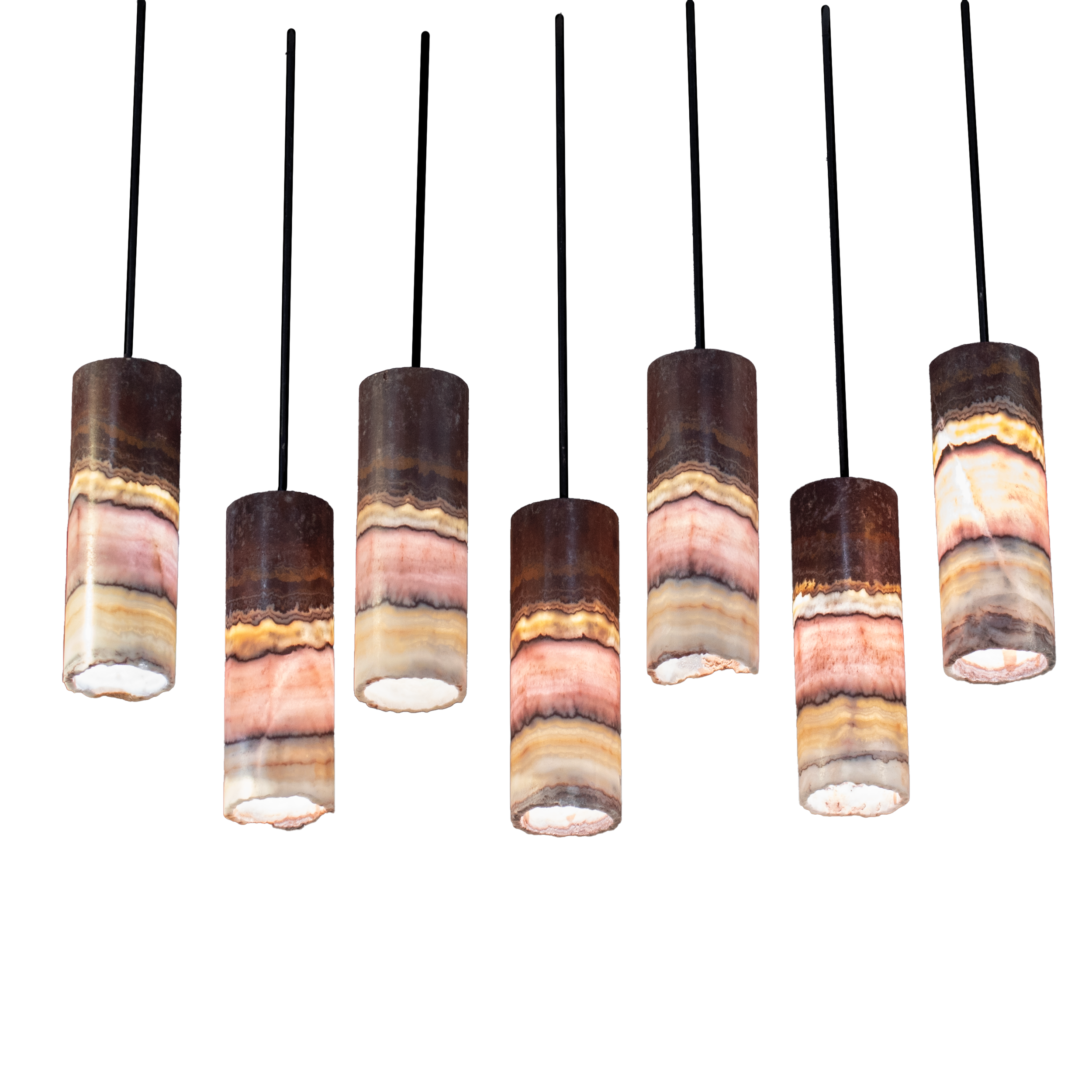 Enhance your living space with the Pink Onyx Pendant Light with Black Line & Hardware - Set of 7. These exquisite luminaries are designed to add a touch of elegance and sophistication to any room. Crafted from luxurious pink onyx, each pendant light showcases a unique interplay of soft, natural hues and intricate patterns formed over centuries. Accentuated by sleek black lines and hardware, these pendant lights offer a modern contrast that complements their timeless beauty.Whether hung above a dining table, kitchen island, or in an inviting entryway, these individual pendant lights provide a warm and inviting glow. The versatility of this set allows for dynamic arrangement possibilities, letting you create personalized lighting compositions to suit your aesthetic preferences. Embodying both form and function, these artistic pieces illuminate your home while serving as captivating home decor elements. Fully embrace the allure of nature's beauty with these stunning Pink Onyx Pendant Lights, each priced individually to offer you flexibility in designing your perfect ambiance. Pink Onyx Pendant Light with Black Line & Hardware - Set of 7 with Custom Canopy