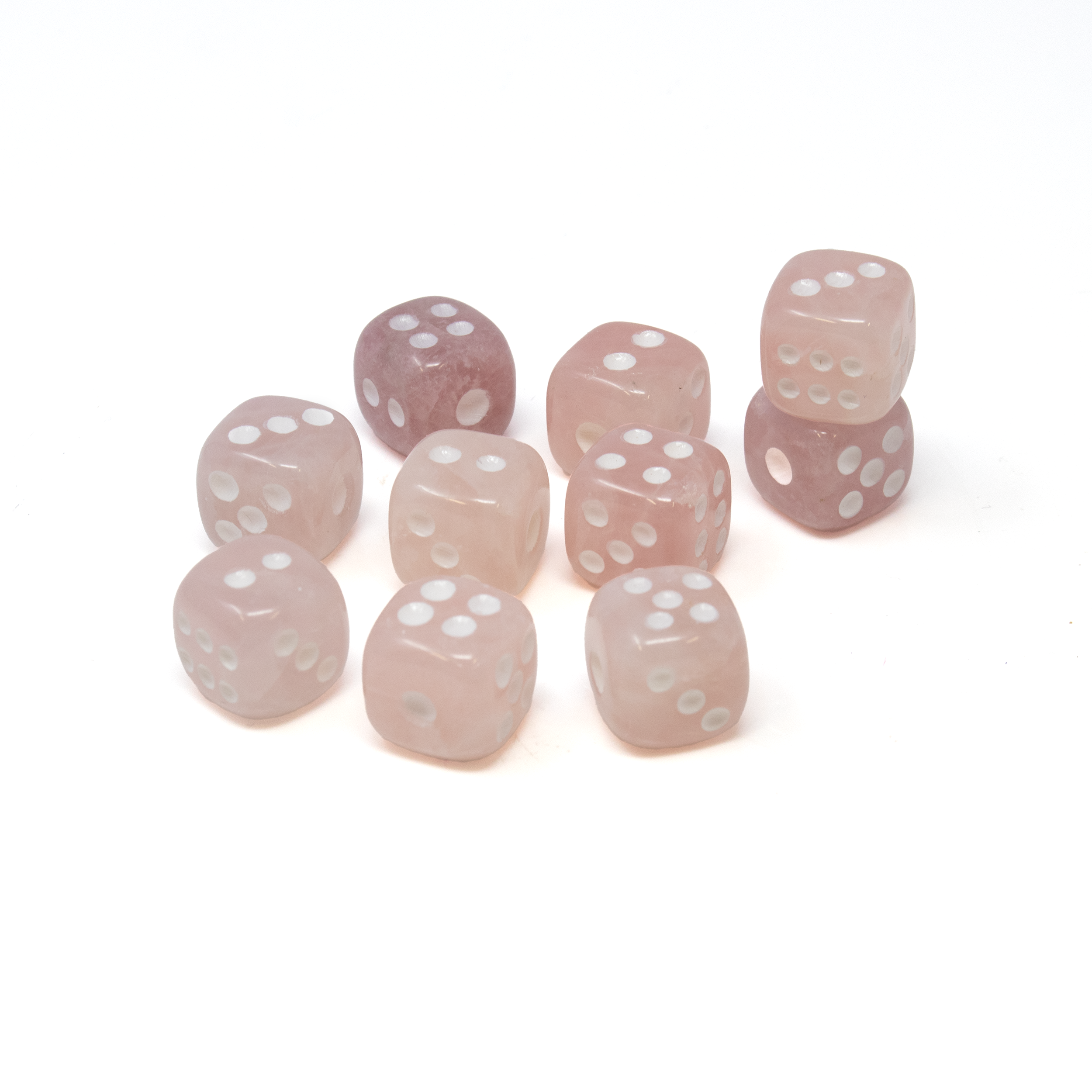 Indulge in the elegance and mystique of the Rose Quartz Carved Dice Set, a perfect blend of functionality and artistry designed to enhance your gaming experience. This captivating set of ten dice, meticulously carved from genuine rose quartz, offers a unique balance between aesthetic appeal and practical use, making it a must-have for gaming enthusiasts and collectors alike.Each die is handcrafted from authentic rose quartz, renowned for its delicate pink hues and natural variations. These alluring tones symbolize love, compassion, and healing, adding an element of warmth and positivity to your gaming sessions. Rose Quartz Carved Dice Set of 10