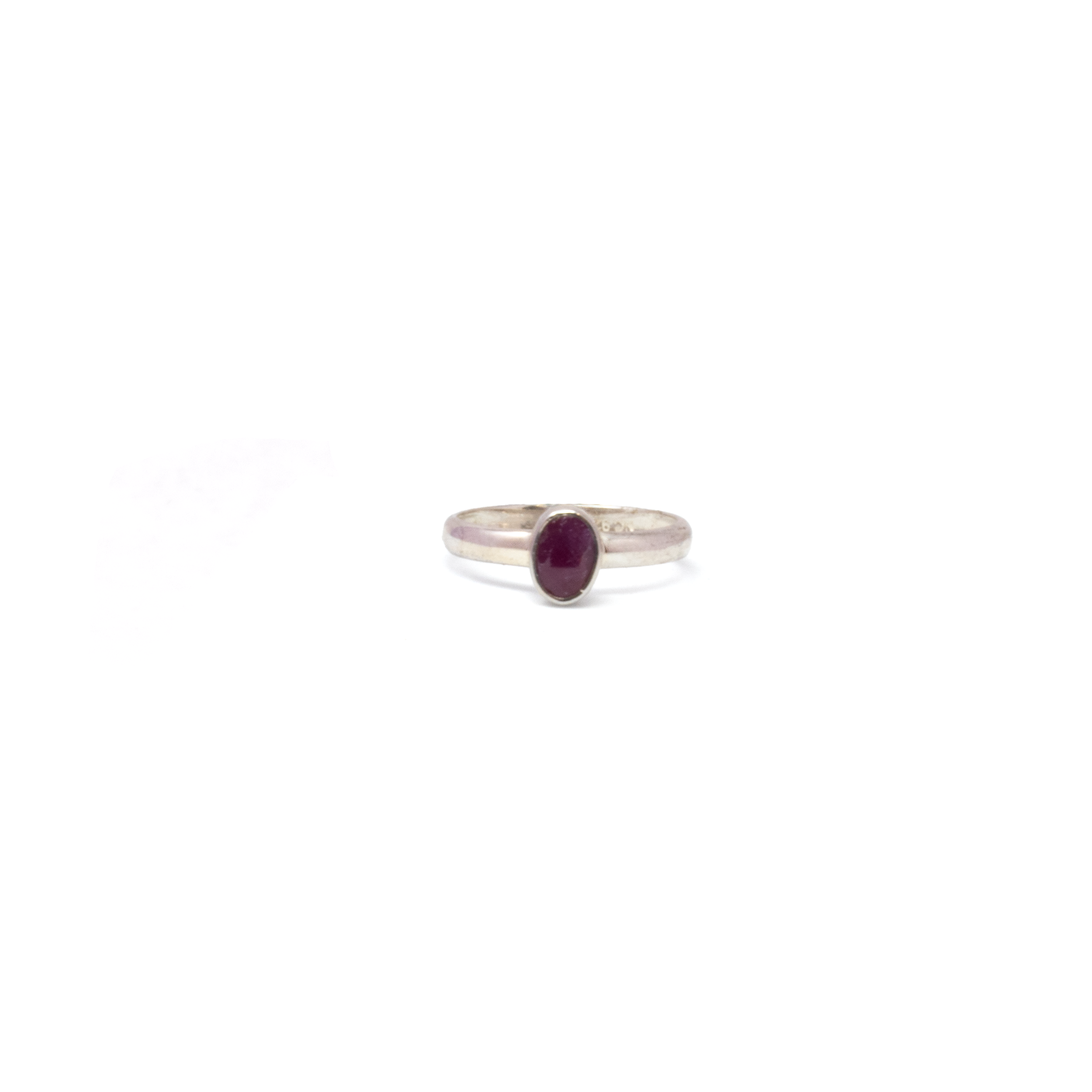 This Faceted Oval-Cut Ruby Ring in 925 sterling silver brings elegant, timeless beauty to your collection. Sized at 8, it features a glowing crimson ruby in a sleek bezel setting—refined, minimalist, and effortlessly sophisticated. A perfect everyday piece or subtle statement for special occasions, this ring celebrates the enduring allure of natural gemstone jewelry. Faceted Ruby Ring - Oval with Simple 925 Sterling Silver Bezel sz8