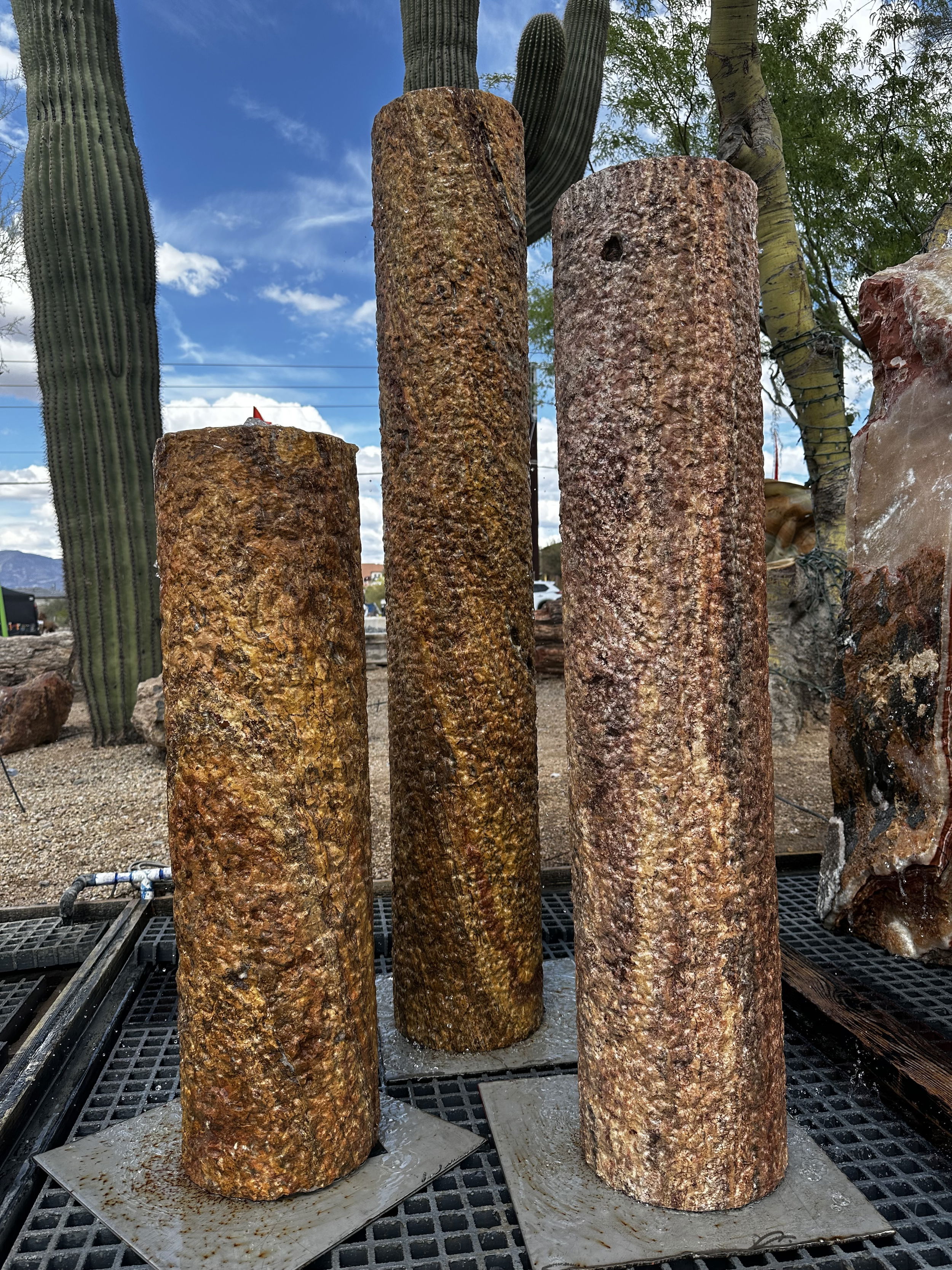 Introducing the exquisite Travertine Cylinder Tower Fountain Set—an elegant addition to any indoor or outdoor space that brings tranquility and sophistication to your environment. Crafted from natural travertine stone, each cylinder showcases unique textures and warm earthy tones, creating a stunning visual centerpiece.The timeless design of the Cylinder Tower combines ancient stone formations with modern aesthetics, ensuring it blends seamlessly with any decor. As water gently cascades down the smooth surface, it produces a soothing sound that transforms your space into a serene sanctuary. IMPORTANT: the purchase price listed is for the FOUNTAIN ONLY and DOES NOT INCLUDE the cost of a basin, pump, parts or installation. Before purchasing a fountain online, we STRONGLY recommend you call us at (480) 575-4360 for a FREE consultation to discuss these additional costs and schedule a pre-site inspection. Also, free shipping does NOT apply to fountains, please call for a quote. Travertine Cylinder Tower Fountain - SET of 3
