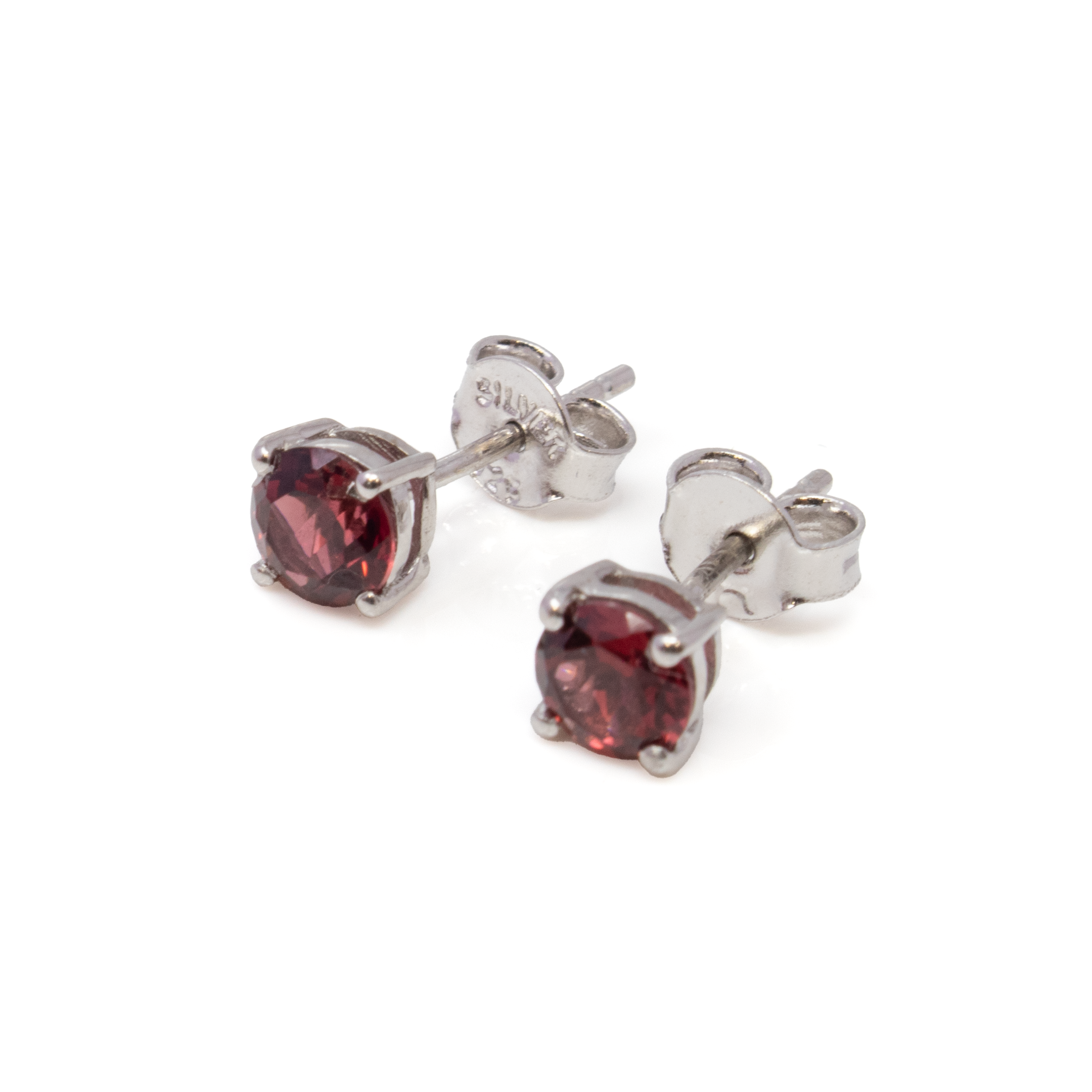 Add a touch of timeless elegance to your jewelry collection with our exquisite Faceted Garnet Stud Earrings. These stunning earrings feature 5mm round garnet gemstones, renowned for their deep, rich red hue and captivating sparkle, skillfully faceted to enhance their natural brilliance.Each garnet is securely set in a classic prong setting crafted from 925 sterling silver, providing a sleek and sophisticated backdrop that beautifully complements the gemstone's vibrant color. The high-quality sterling silver not only ensures durability but also offers exceptional shine and resistance to tarnish, making these earrings a perfect choice for everyday wear or special occasions. Faceted Garnet Stud Earrings - 5mm Round Prong Set with 925 Sterling Silver