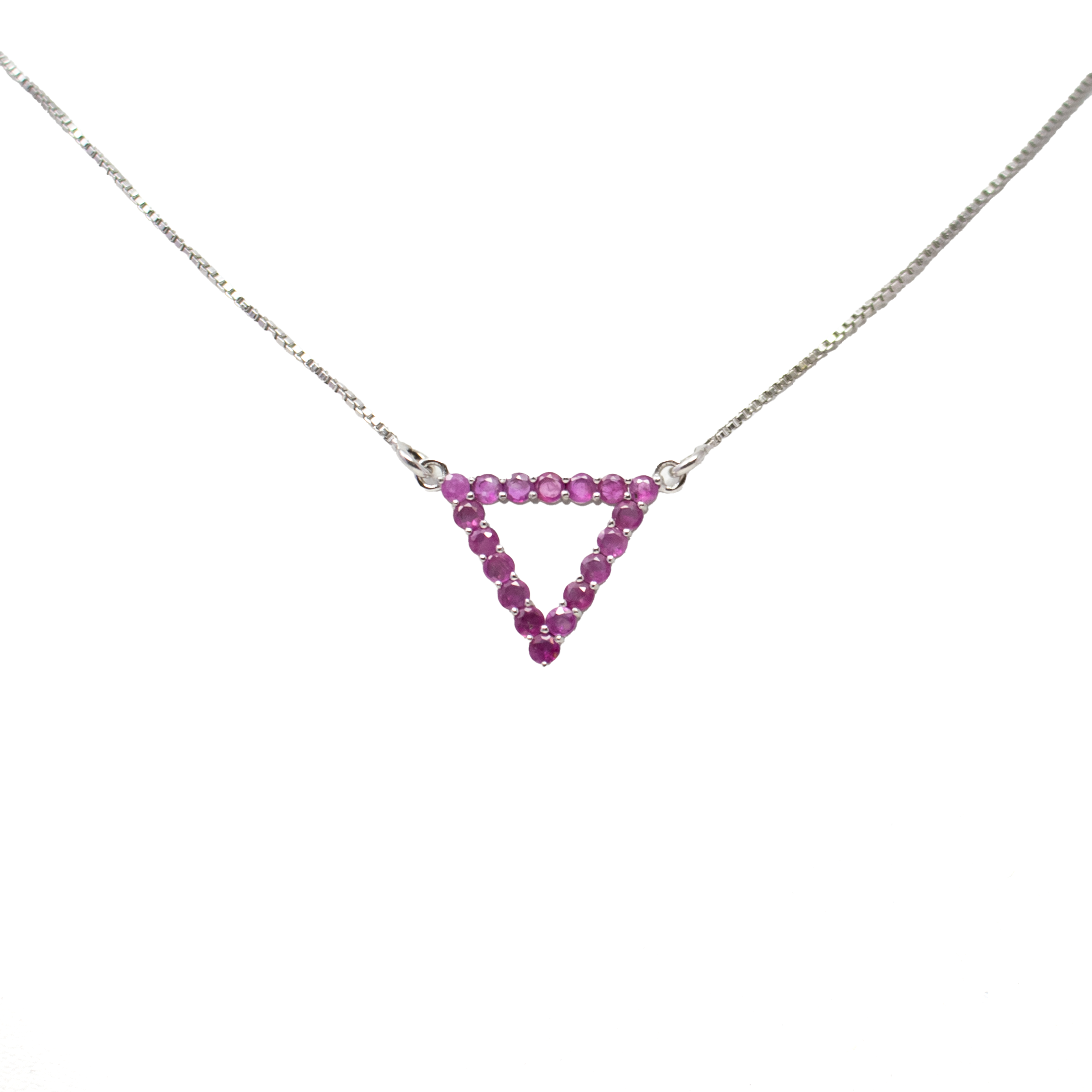 Elevate your style with this stunning Faceted Ruby Necklace, featuring a modern open triangle pendant adorned with 18 prong-set, faceted round rubies. Each vibrant gemstone catches the light with fiery brilliance, creating a bold yet refined statement that draws the eye.Suspended from a sleek 925 sterling silver box chain, this piece blends contemporary design with classic luxury. Perfect for wearing alone or layered, it adds a pop of color and sophistication to any look. A radiant addition to any jewelry collection, ideal for special occasions or everyday elegance. Faceted Ruby Necklace - Open Triangle with 18 Prong Set Faceted Rounds on Simple 925 Sterling Silver Box Chain