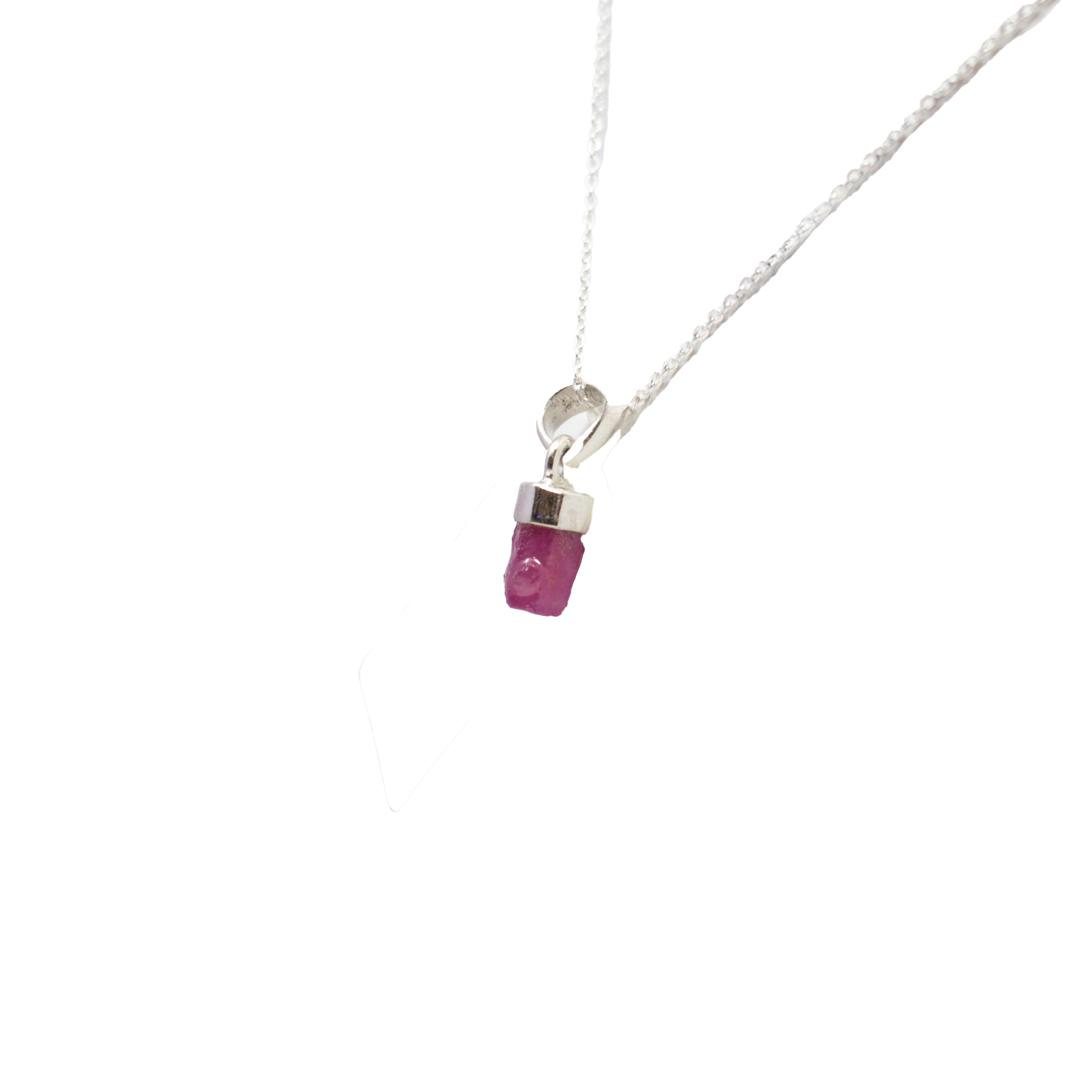 Bold and refined, this Ruby Pendant showcases a raw freeform ruby framed in a smooth 925 sterling silver lantern-top bezel. Each stone is naturally shaped, with deep red tones that bring warmth and character to the piece. The minimal setting lets the gem speak for itself—organic, vibrant, and unmistakably one-of-a-kind. A striking pendant for those drawn to unpolished beauty and timeless design. Ruby Pendant - Rough Freeform with 925 Sterling Silver Lantern Top bezel