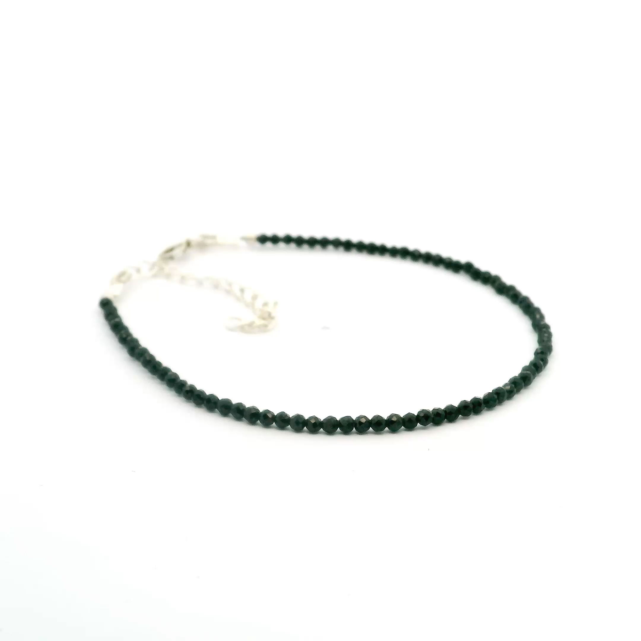 Introducing the Black Spinel Beaded Bracelet from Rare Earth Gallery. This classic bracelet showcases the brilliance and allure of 2mm faceted black spinel rounds. The single-strand design of this bracelet offers beautiful simplicity, allowing the natural beauty of the black spinel to take center stage. Whether you're treating yourself or looking for a thoughtful gift, the Black Spinel Beaded Bracelet is a stunning testament to elegance and style. Black Spinel Beaded Bracelet - 2mm Faceted Rounds - Single Strand